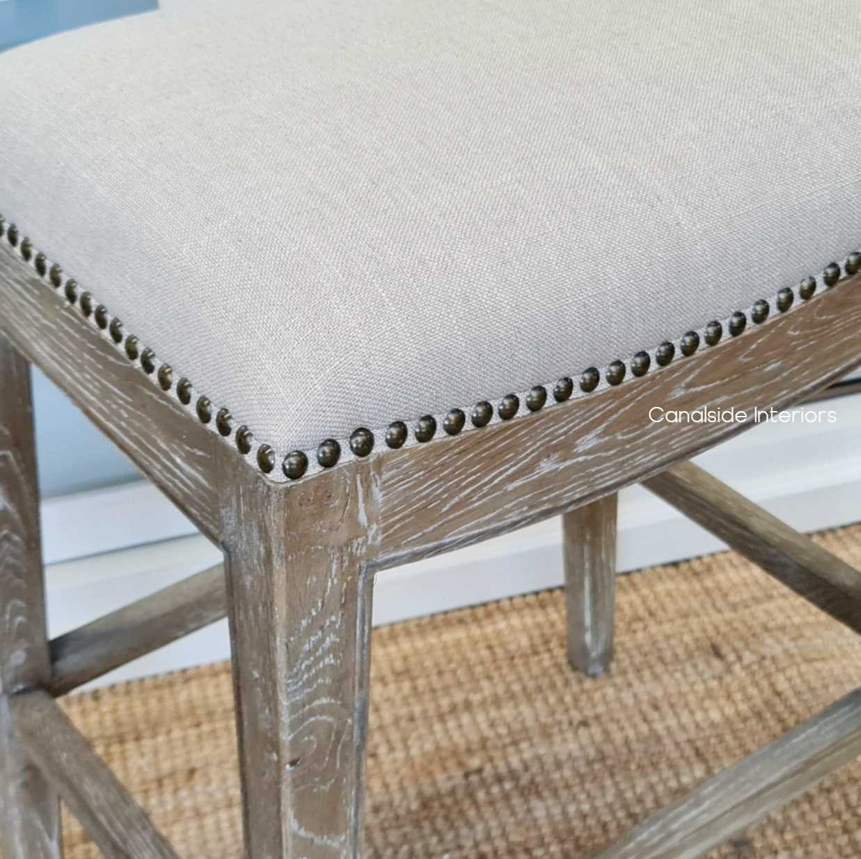 Close-up of the Mila II Kitchen Bar Stool showing the exquisite stud detailing and texture of the cream upholstery - a testament to quality craftsmanship.