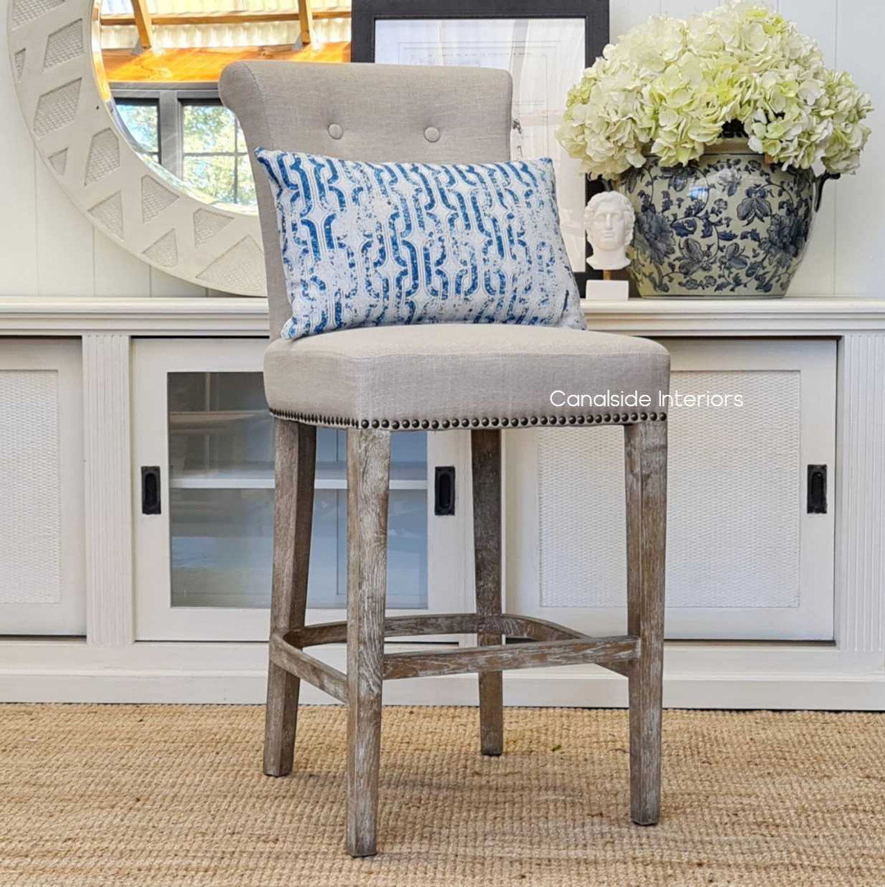 Montague Bar Stools in a bright, airy space, showcasing their role in creating inviting dining areas that merge functionality with aesthetic appeal in coastal and Hamptons-inspired homes.