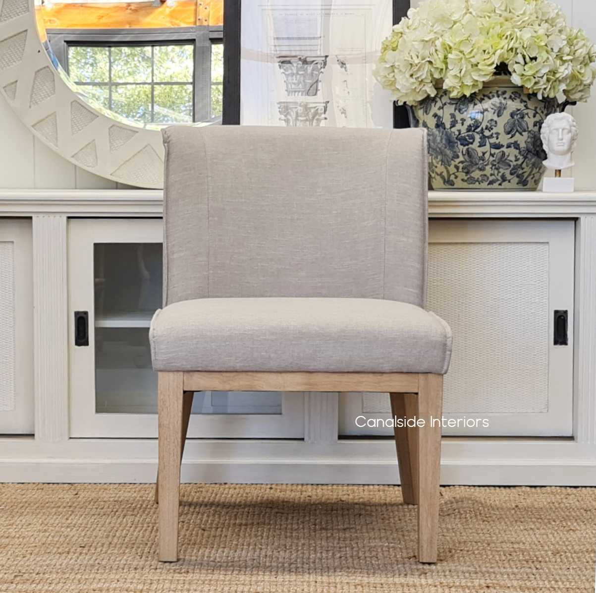 The Norris Chair's slimline design and beautiful stitching details are a testament to the classical elegance at Canalside Interiors