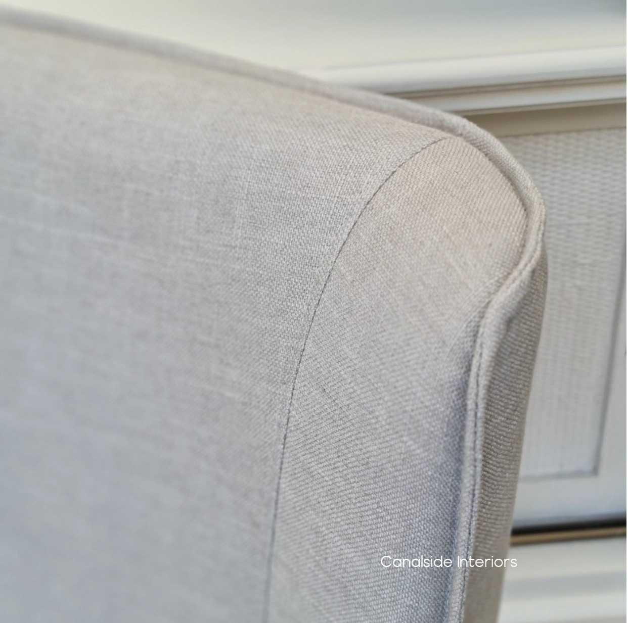 Infuse your library or home office with a sense of modern luxury with the cream linen Norris Chair, complete with quality natural legs