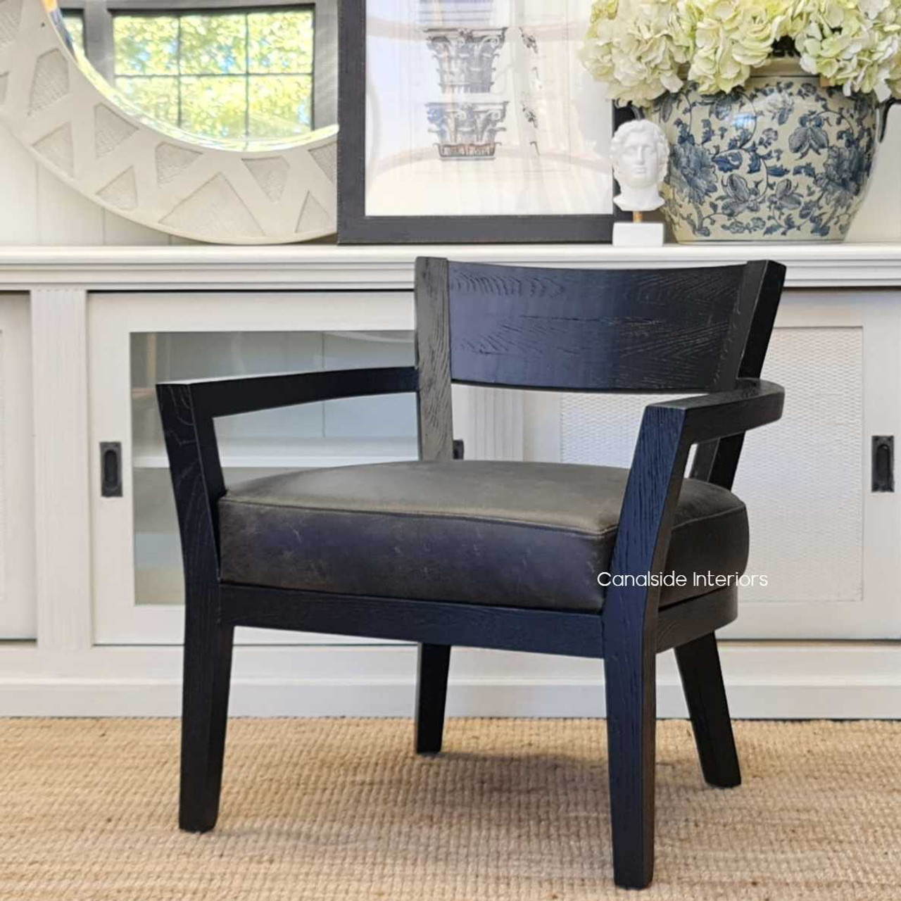 Integrated into a Hamptons-style interior, where its distressed leather complements the coastal, breezy aesthetic of the room.