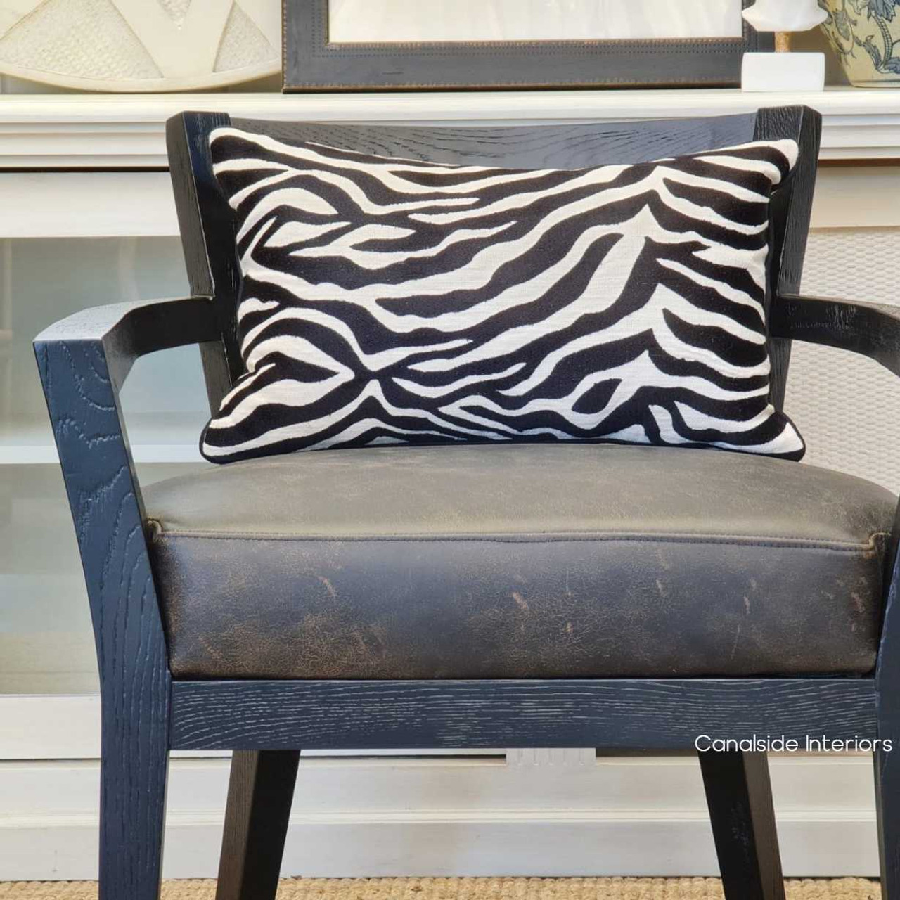 Lifestyle image depicting the armchair in a home office, enhancing the space with its luxurious and comfortable design.