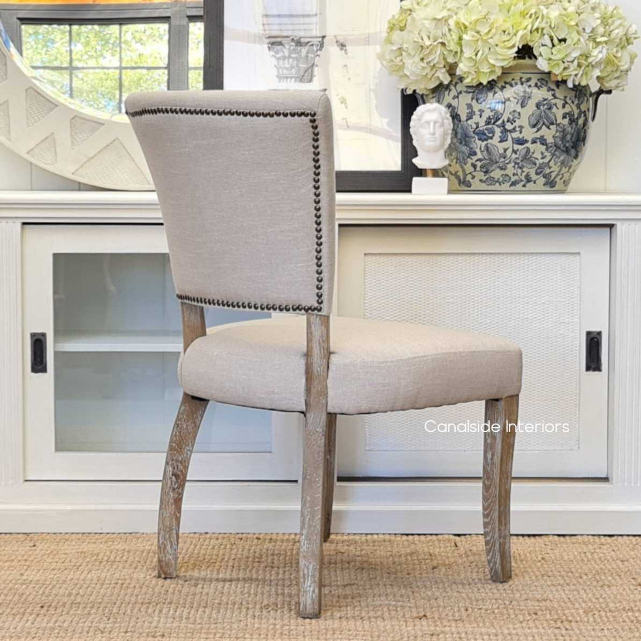 Close-up on the brass stud detailing of the Mimi Dining Chair, highlighting its elegant craftsmanship and quality design.