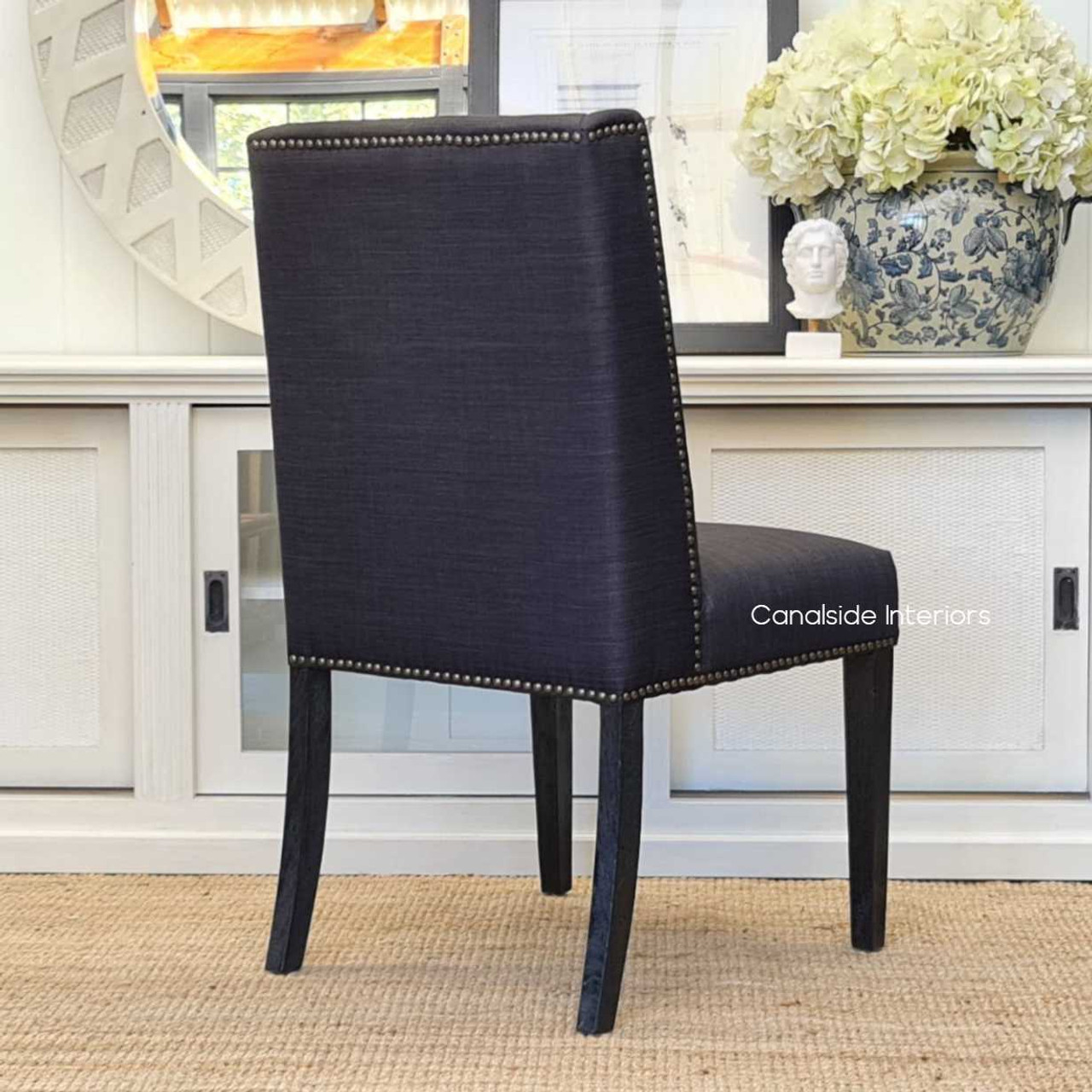 Experience the comfort of the Leclerc Chair with its tailored upholstery and meticulous design, a staple for modern, quality interiors