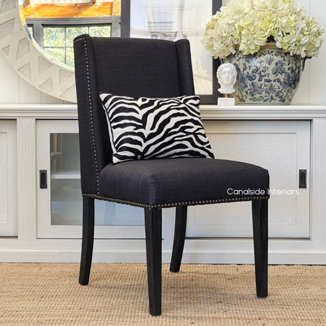Introduce a piece of sophisticated elegance with the Leclerc Chair, featuring deep espresso legs that complement any classy dining space