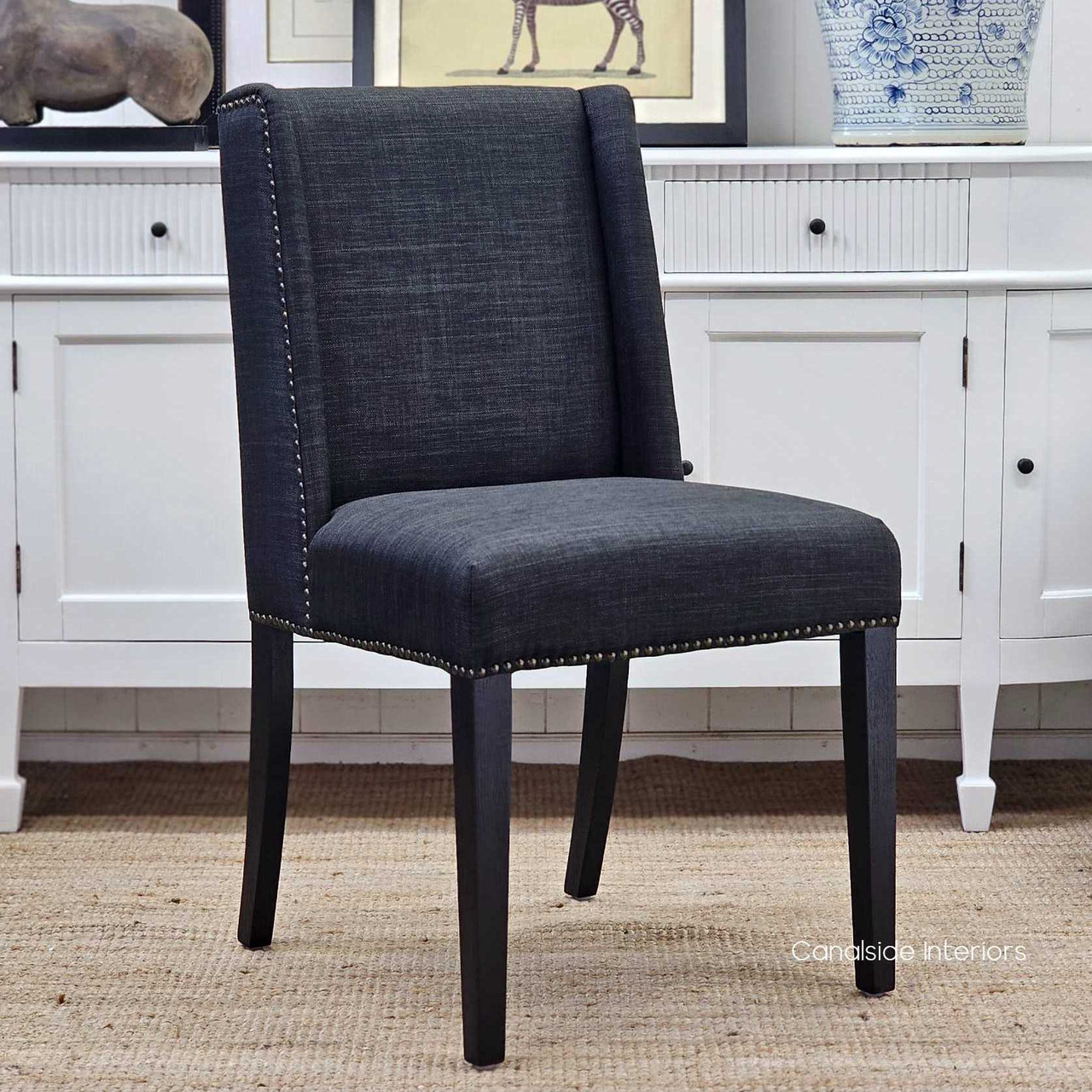Leclerc Dining Chair, Sleek Elegance in Black Linen Blend Upholstery, Black Oak Legs, Brass Stud Detail, Front Angled View