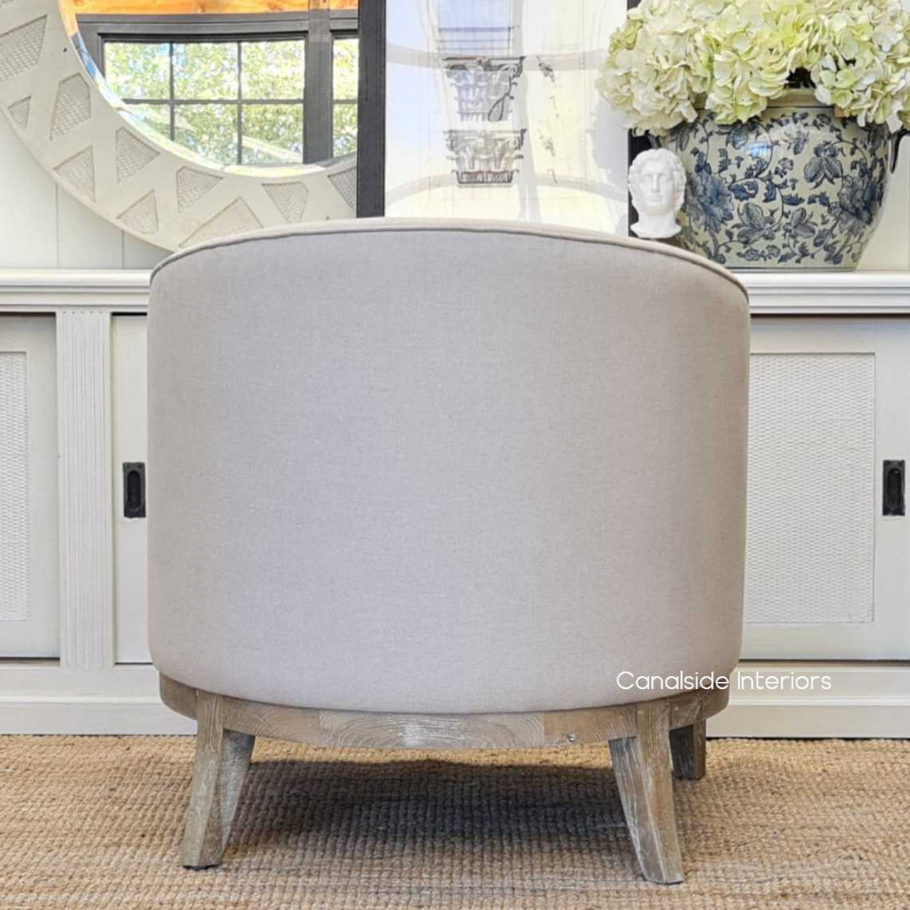 Infuse your dining room with the timeless beauty of the Hamilton Tub Armchair, upholstered in cream for a touch of Hamptons luxury