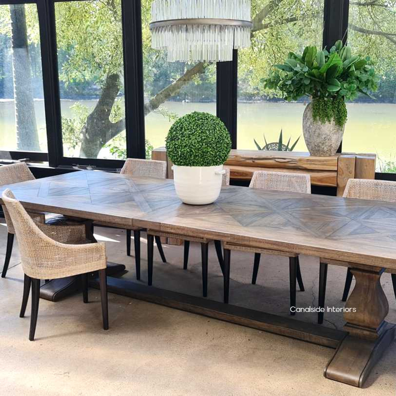 The table as part of an elegant Hamptons Dining ensemble, welcoming guests with its splendor and unique Hamptons-inspired design.