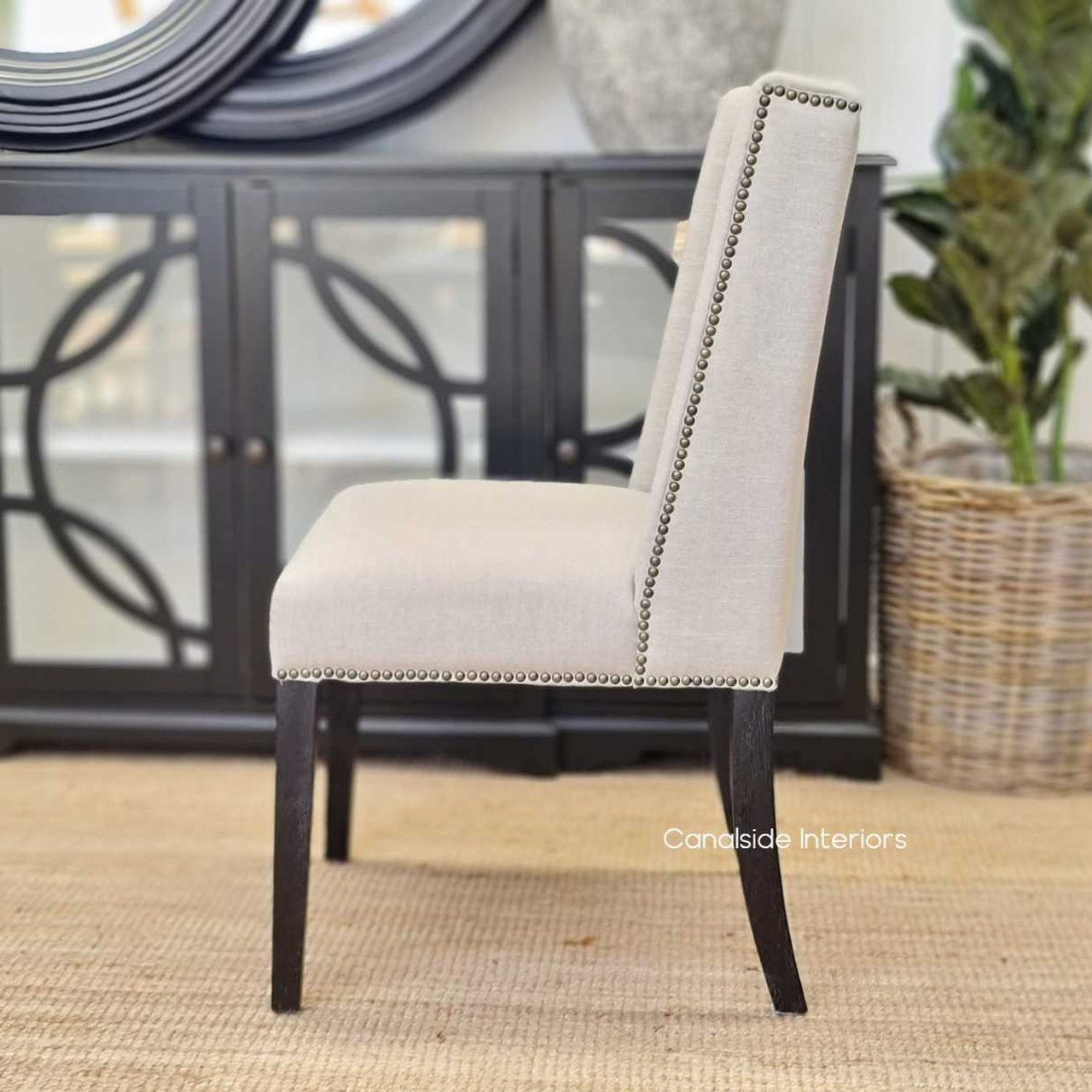 The craftsmanship of the Leclerc Chair, focusing on the seamless stitching and fabric tension that ensures durability and comfort.