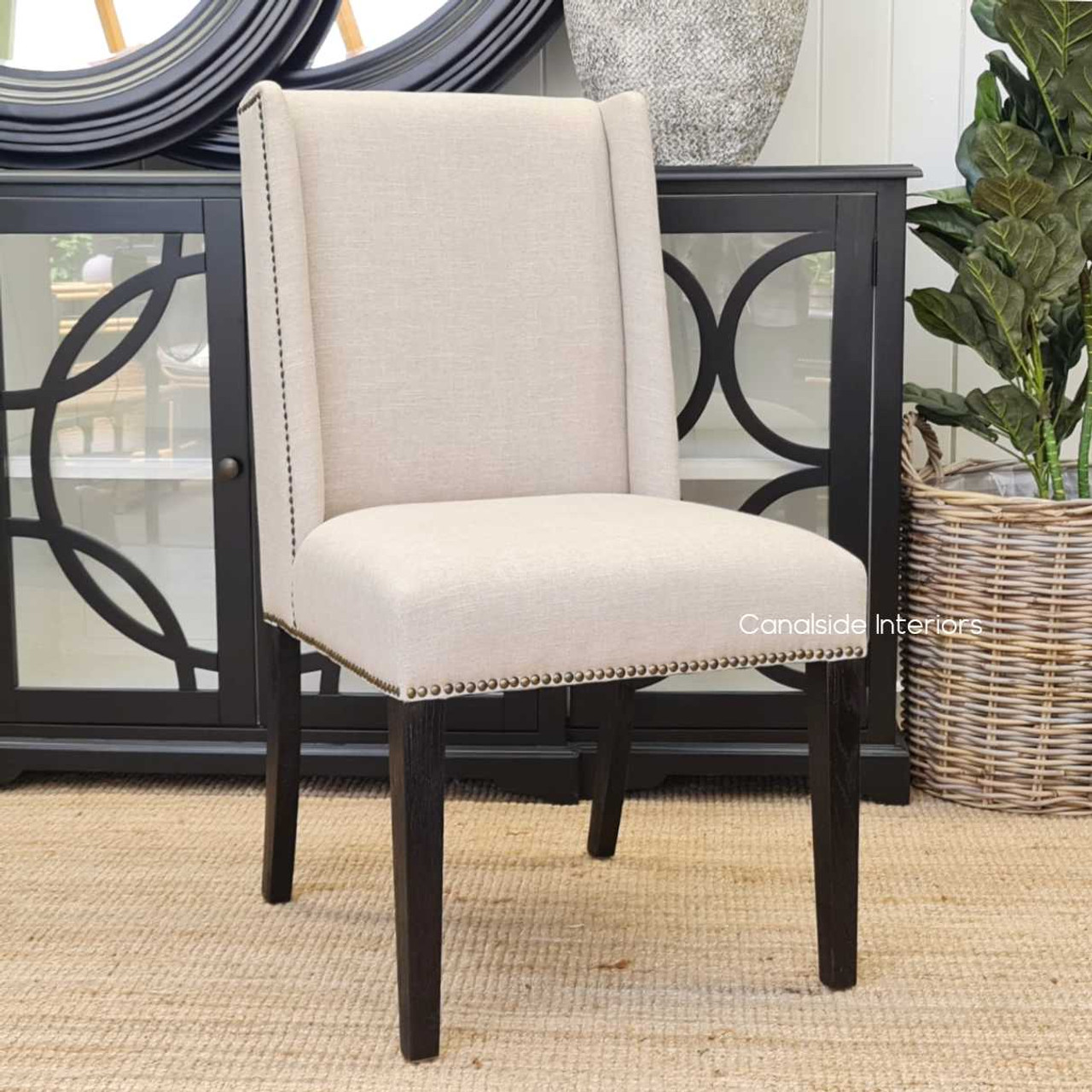 Leclerc Dining Chair's profile in an open-concept living and dining area, demonstrating its ability to blend into various living spaces seamlessly.