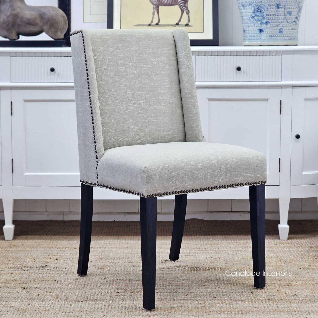 Leclerc Dining Chair, Timeless Sophistication in Cream Linen Upholstery, Black Oak Legs, Brass Stud Detail, Front Angled View