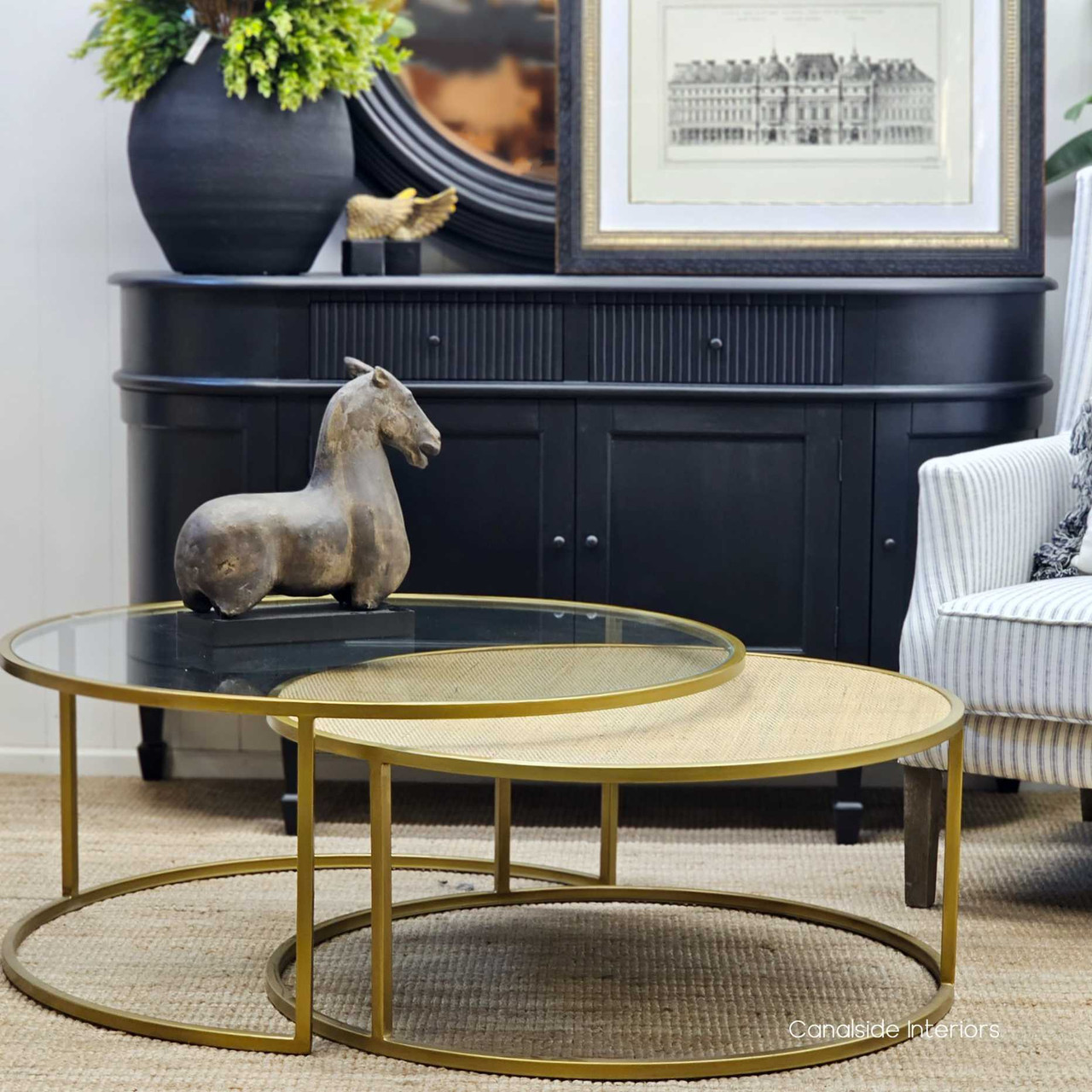 These Knox Nesting Tables from Canalside Interiors, with their distressed gold finish, provide a flexible and chic coffee table solution for contemporary dining rooms