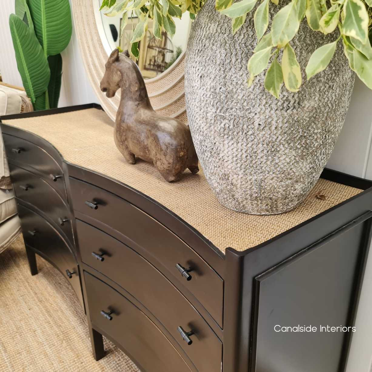 Side perspective capturing the elegant silhouette and substantial storage capacity of the grande double chest, suitable for sophisticated interiors.