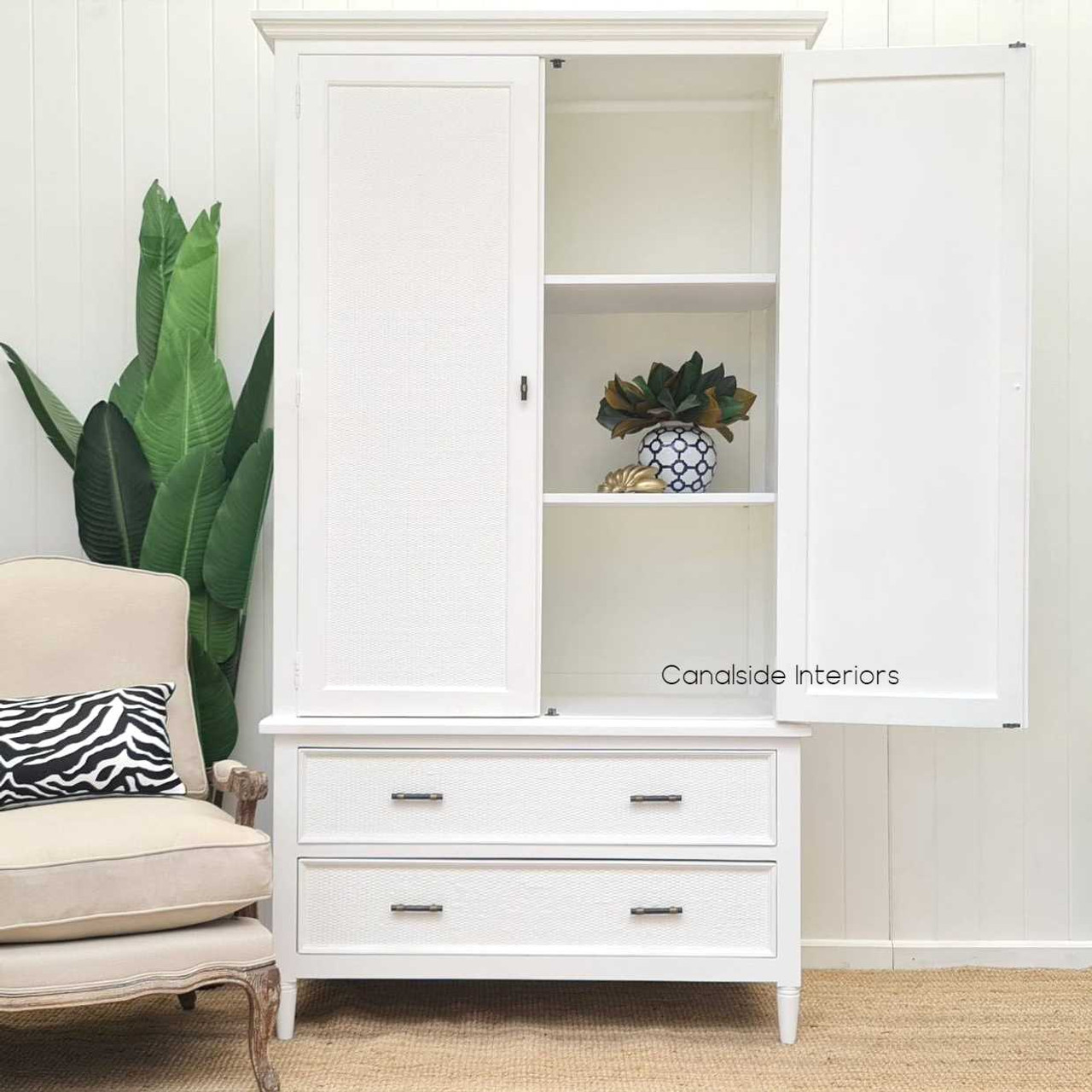 Interior configuration of the wardrobe, highlighting the customizable storage options with removable shelves.