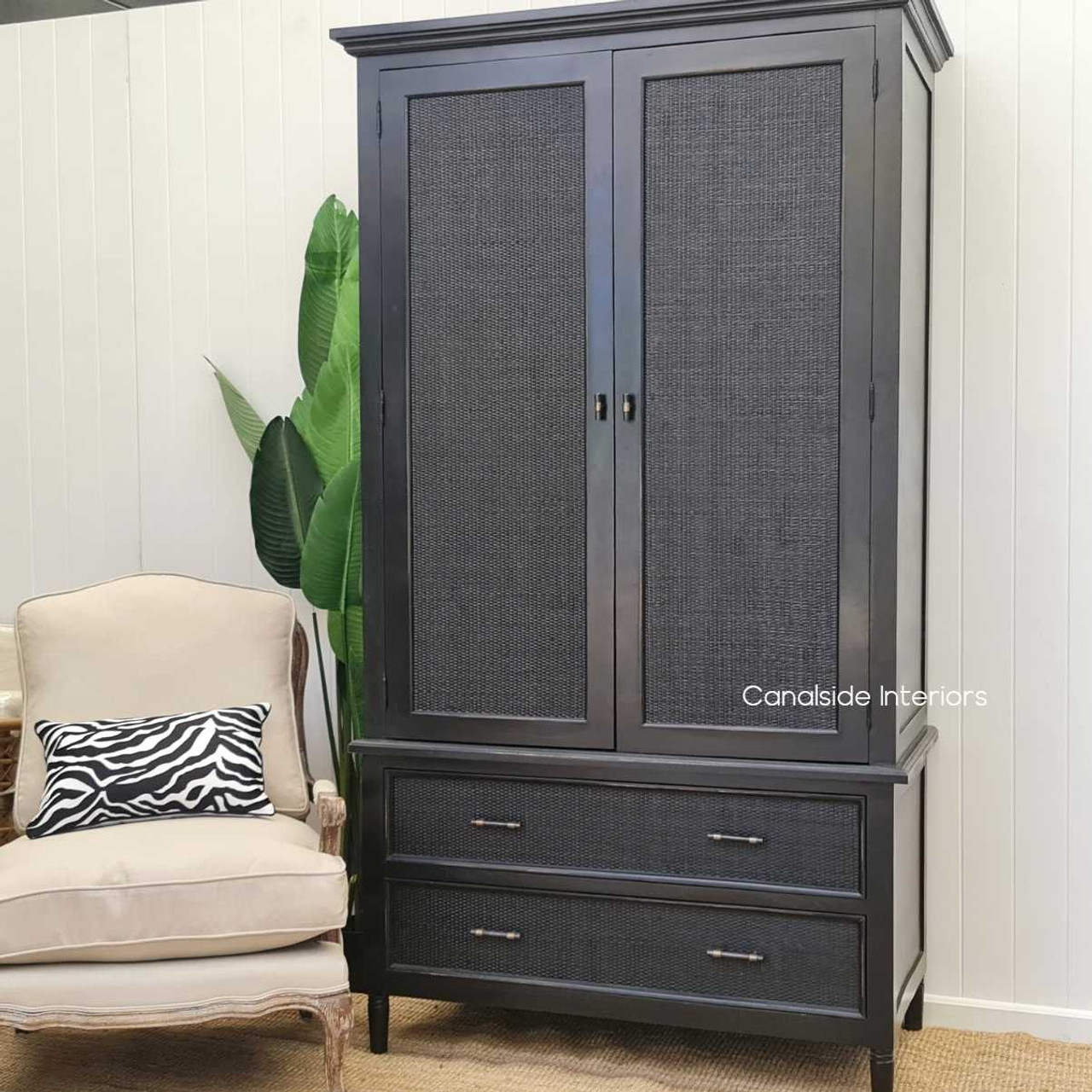 Profile view against a neutral-colored wall, showing how the wardrobe complements various interior styles with its clean lines and chic color palette.