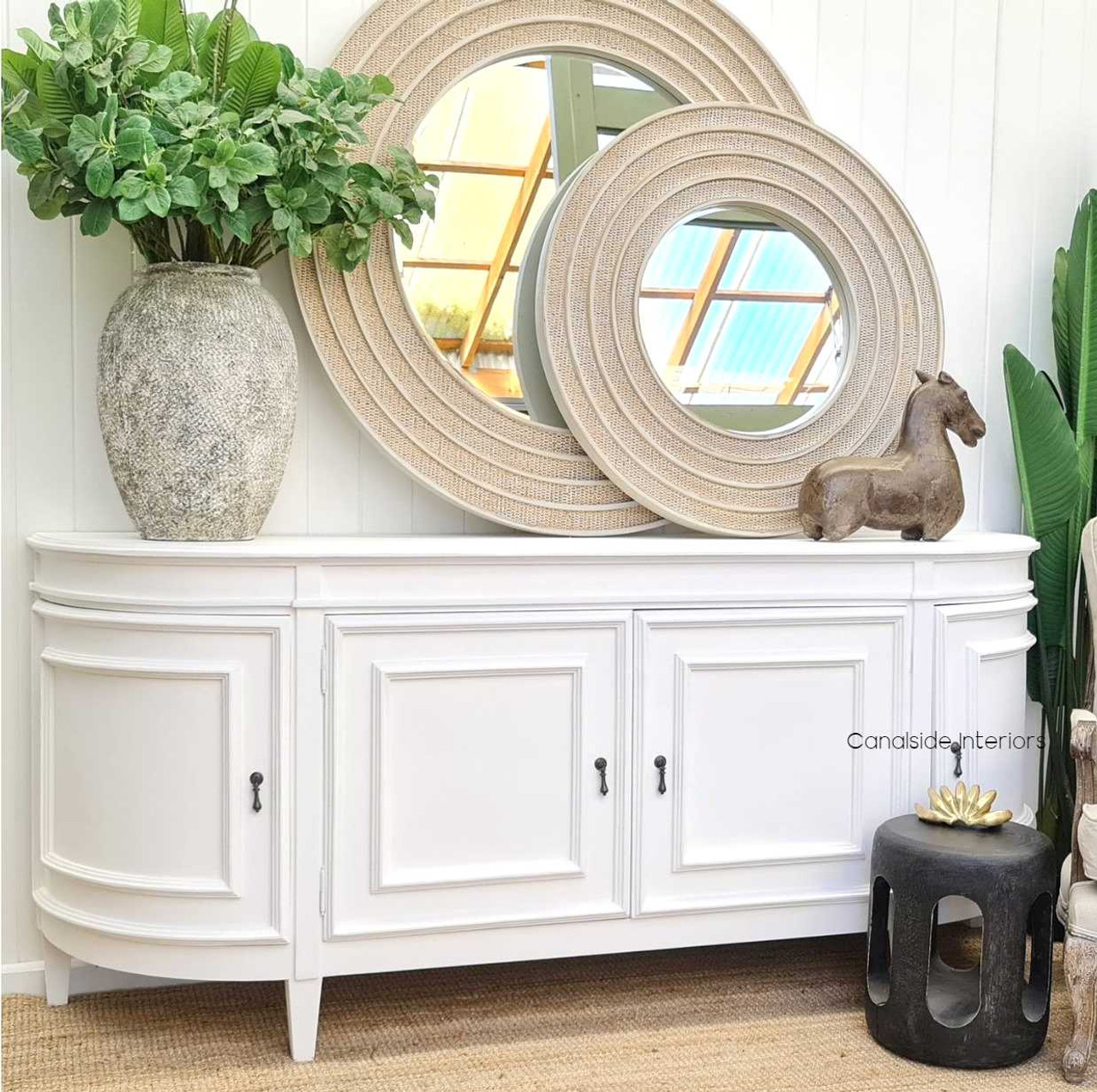 Bring the essence of coastal charm into your dining space with the Francia Sideboard in distressed white, where functionality meets Canalside Interiors' classic grandeu