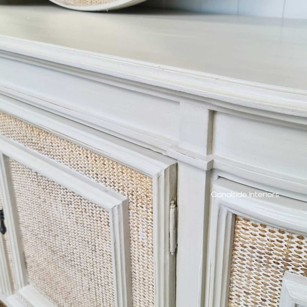 In a modern home office, the Francia Stone Rattan Sideboard by Canalside Interiors provides a stylish organizational hub with its distinctive weave and stone finish.