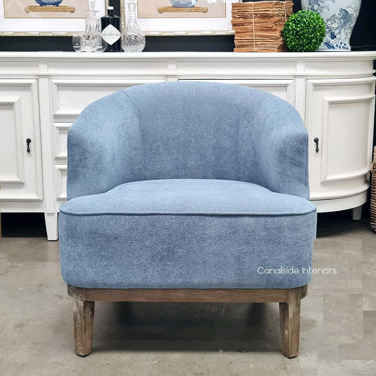 Experience luxury in your dining room with the Hamilton Armchair, a statement piece in chenille blue from Canalside Interiors