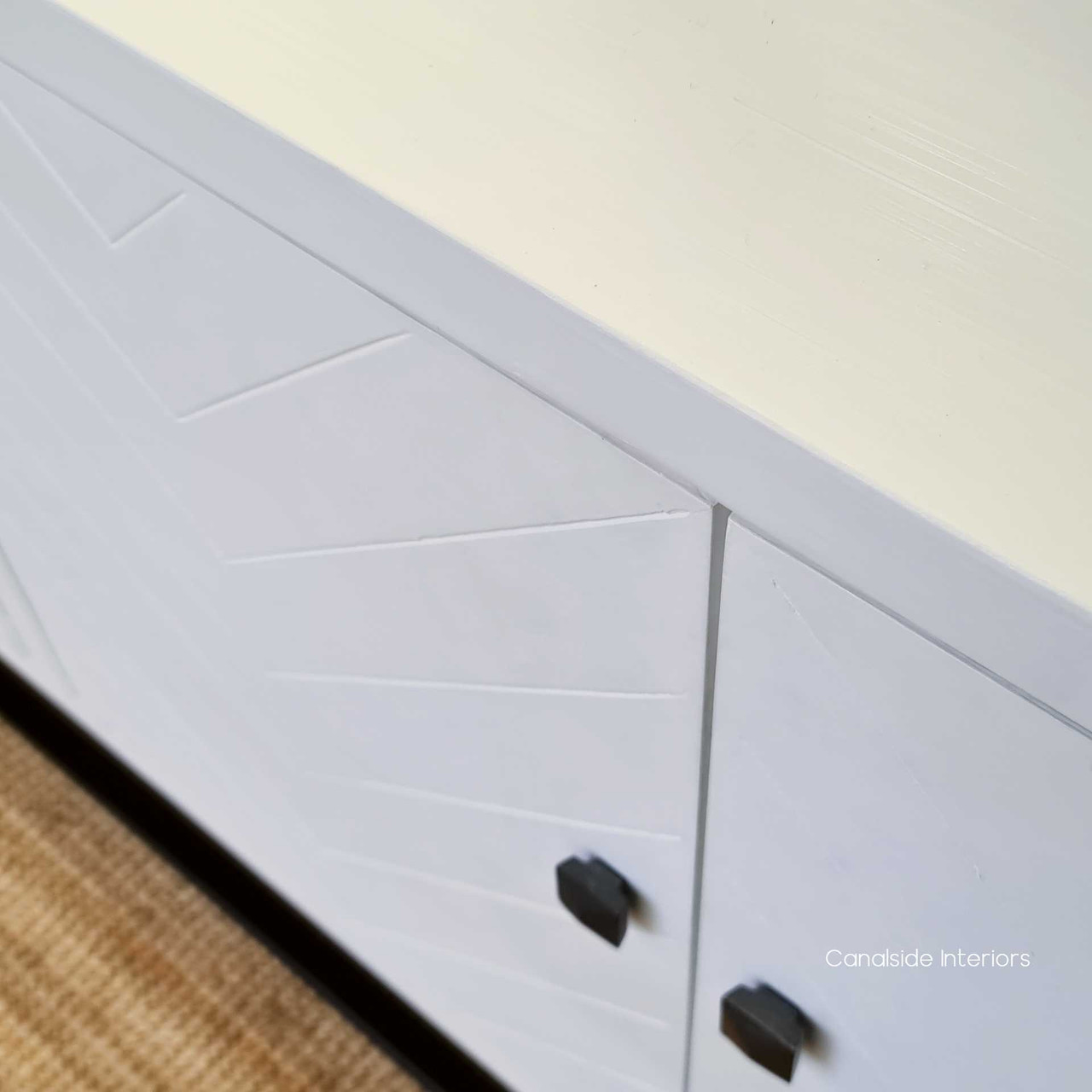 Canalside Interiors presents a piece that perfectly captures the essence of chic plantation living with its St Lucia Herringbone Sideboard in distressed white