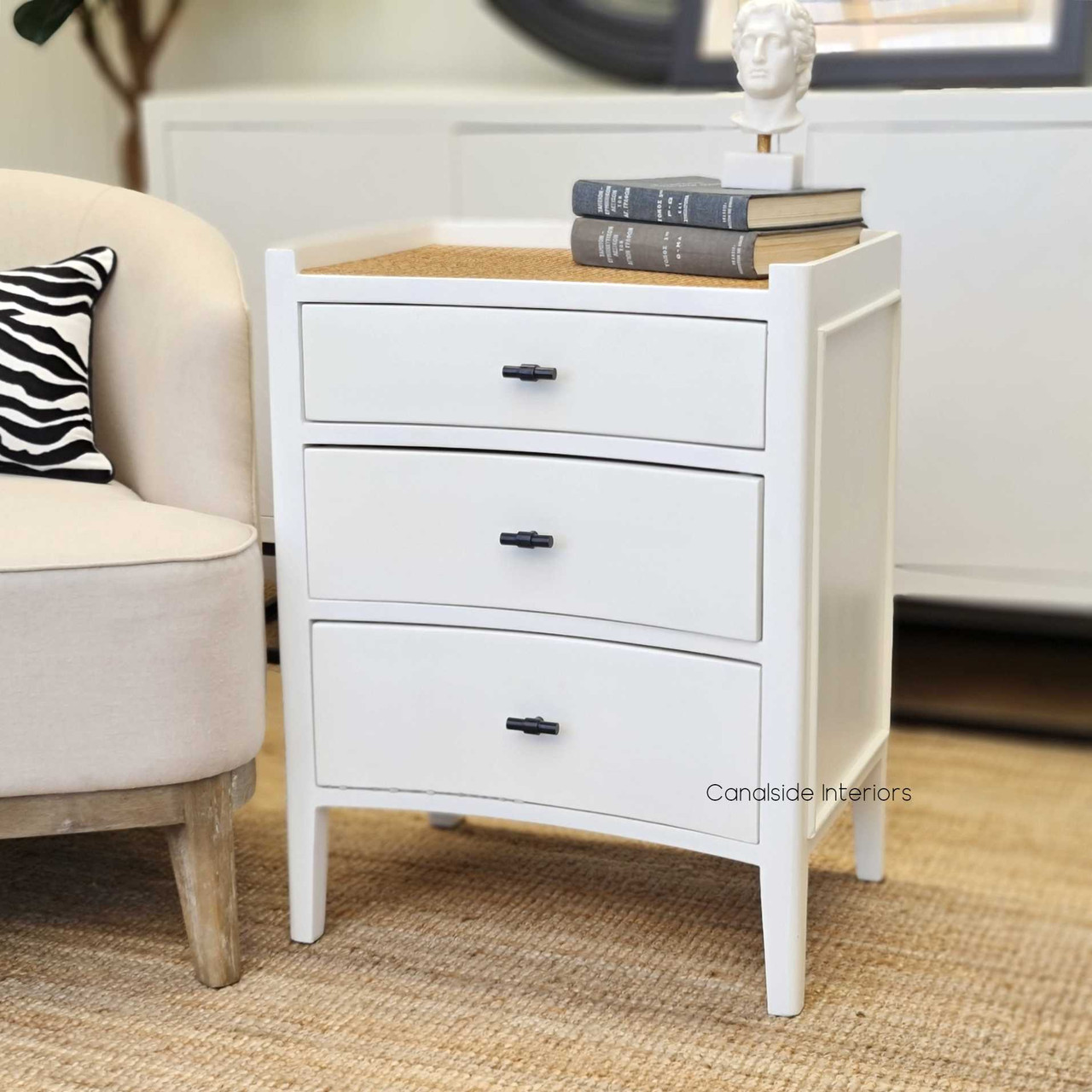Lifestyle image depicting the bedside table being used to display a accessories and books, adding functionality and style to the room.