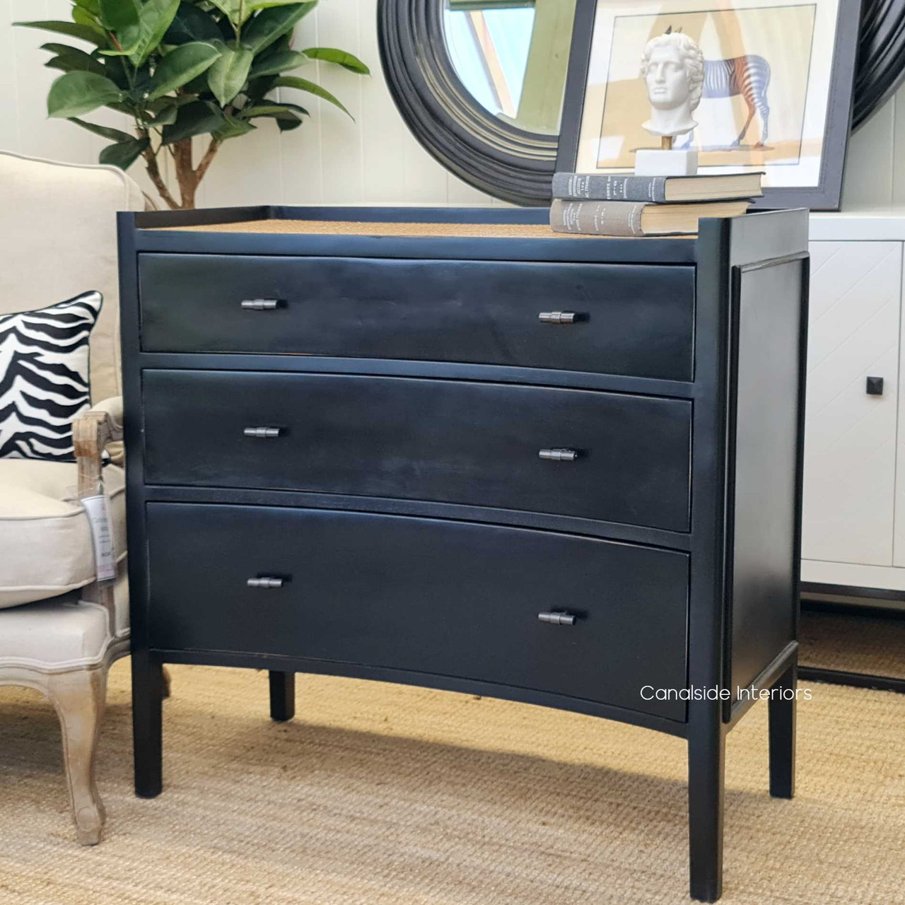 Angled perspective showcasing the chest’s unique concave face, enhancing its architectural beauty and providing a sophisticated storage solution.