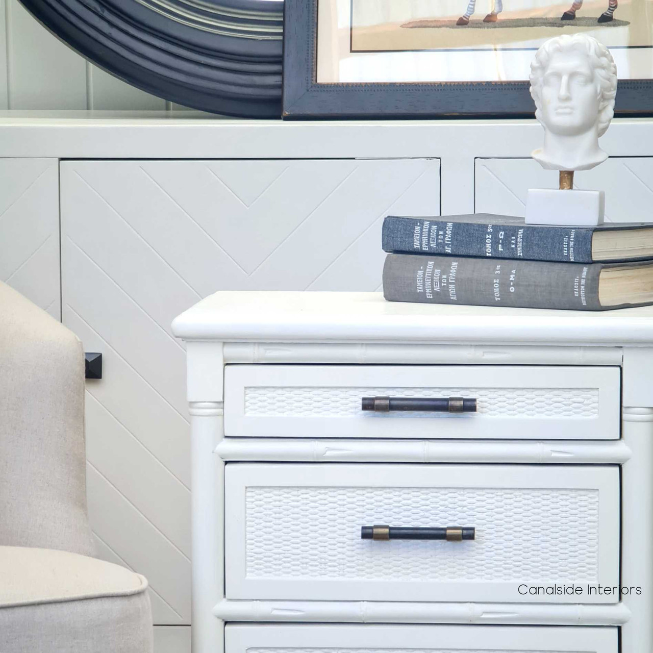 A side view of the Brielle Rattan Bedside in Distressed White, highlighting the fine craftsmanship and British Colonial influences from Canalside Interiors
