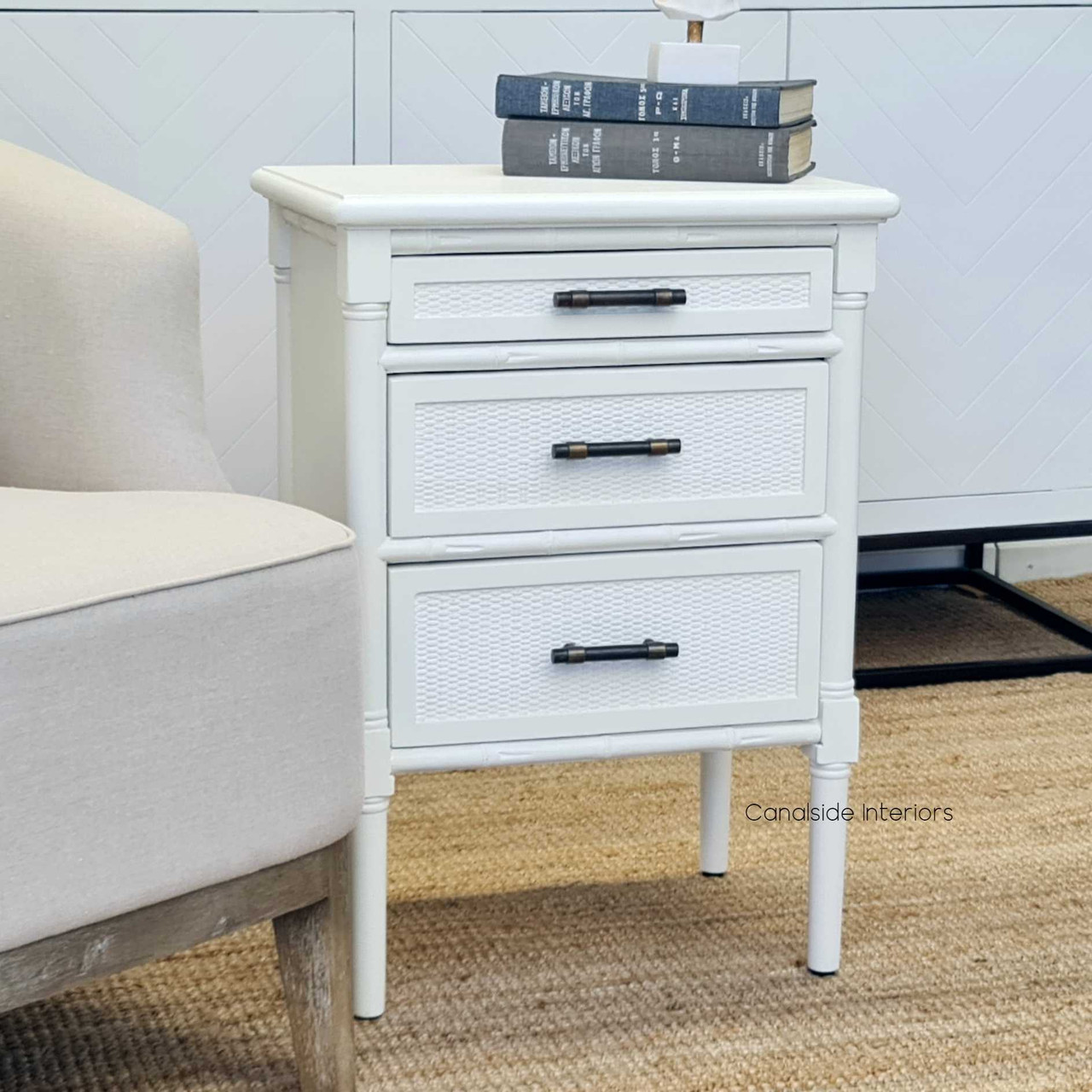 Elegant Distressed White Brielle Rattan Bedside Table featuring brass handles and British Colonial charm – perfect for bedroom storage solutions