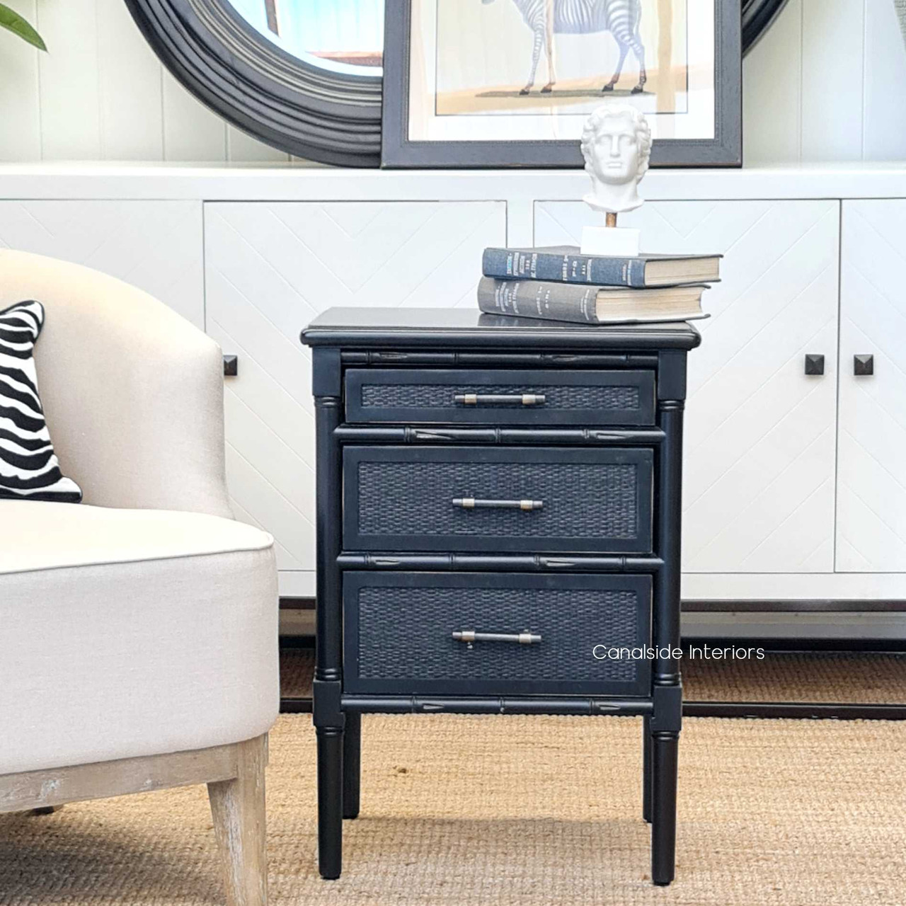 Enhance your bedroom's functionality and style with the Brielle Rattan Bedside's three drawers and rattan detailing.