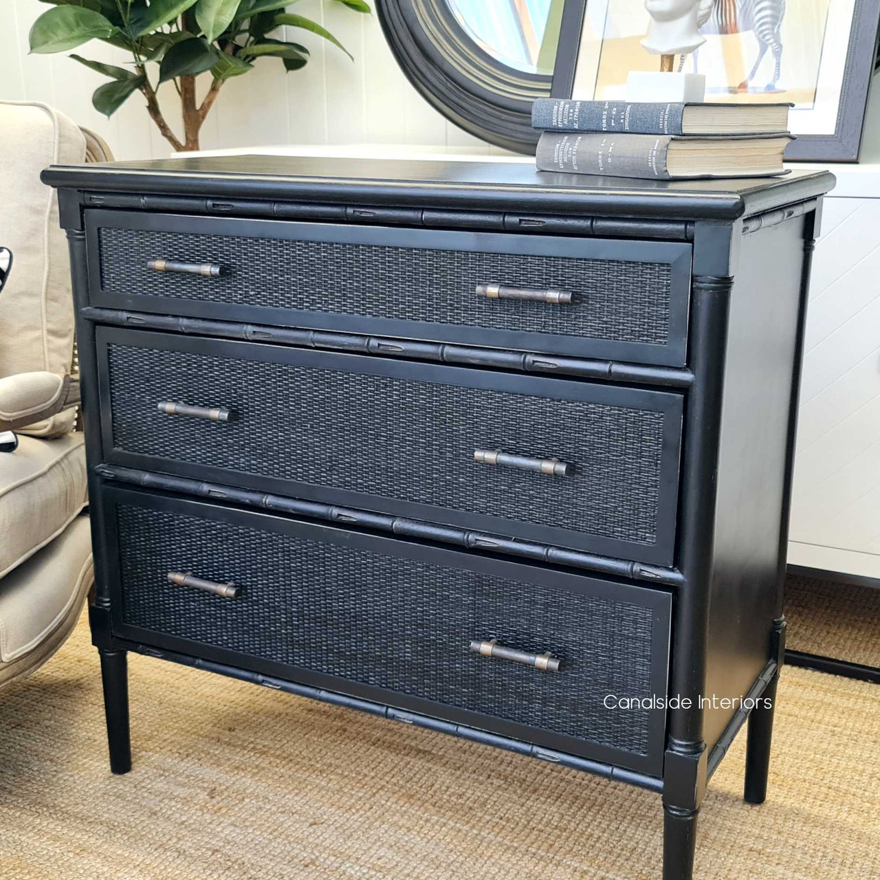 The Brielle Rattan Chest, a perfect addition to a coastal-inspired dining room, combines ample storage with on-trend British Colonial style