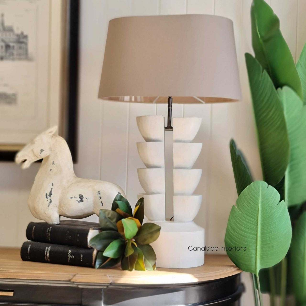 View of the handcrafted timber Ambroise Lamp from Canalside Interiors, highlighting its unique natural and recycled timber charm.