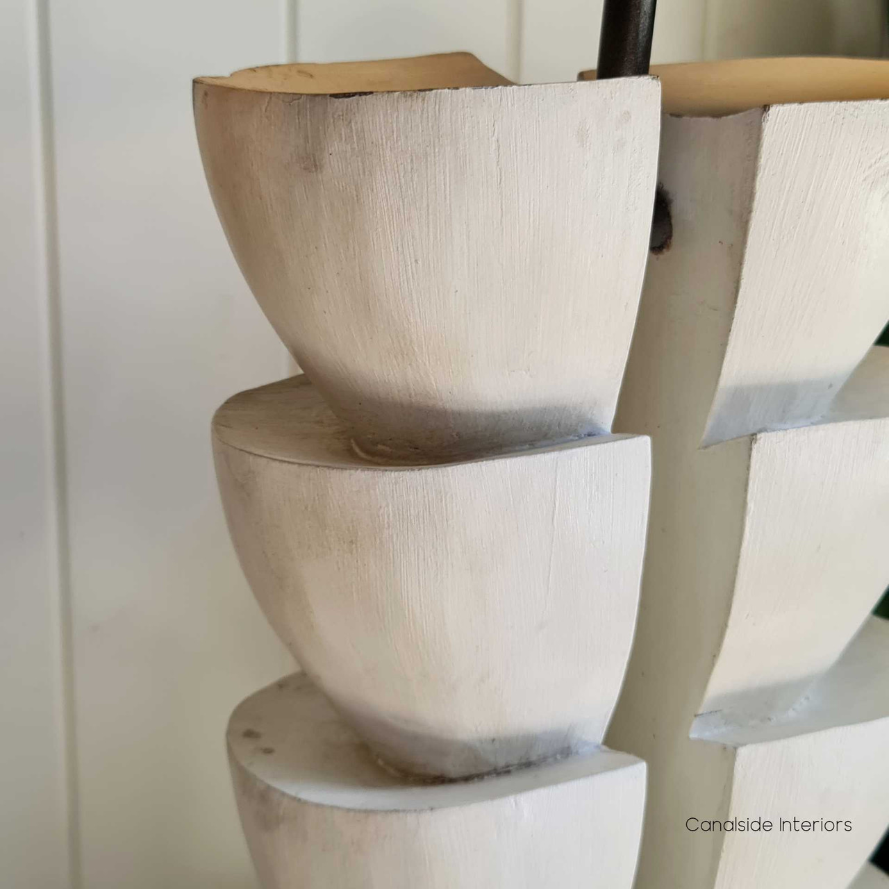 The rustic recycled charm of the Ambroise Lamp set in a modern living room, blending classical elegance with modern sensibilities.