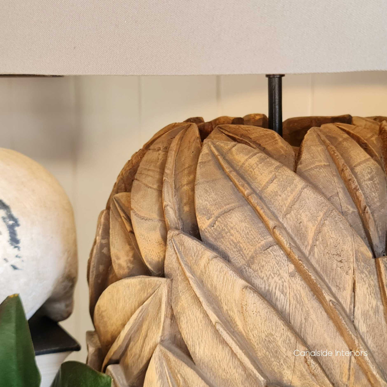 Profile view against a minimalist backdrop, highlighting the lamp's sleek design and timeless appeal.