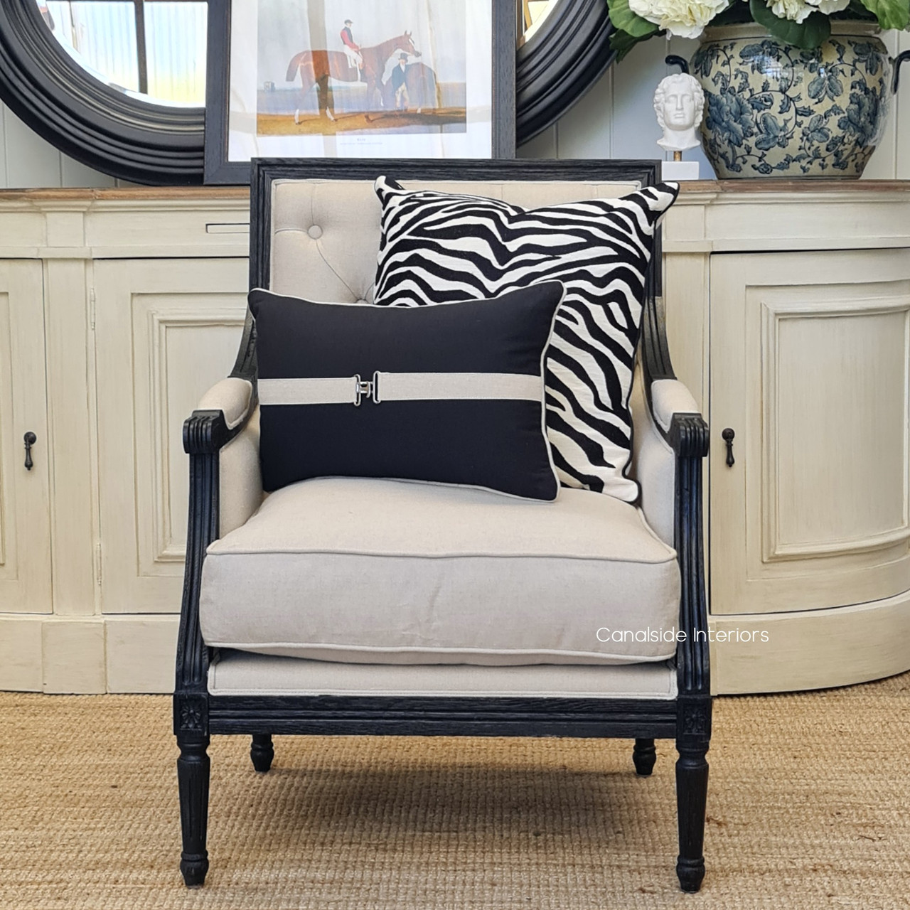 Pairing the armchair with a French style sideboard, showcasing its versatility across decor styles.