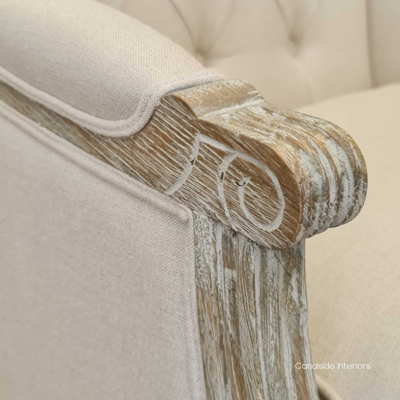 Weathered oak arms in detail, showcasing the stability and style of this exquisite armchair.