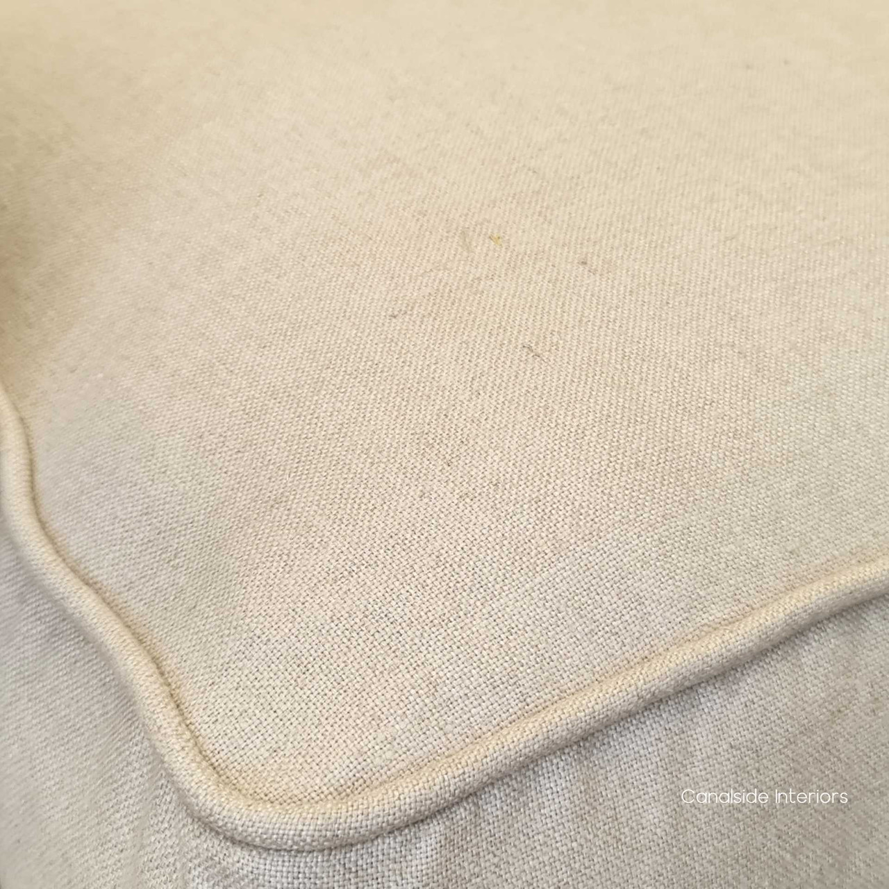 Soothing cream tones of the Pearson Armchair enhancing a coastal-themed lounge room.