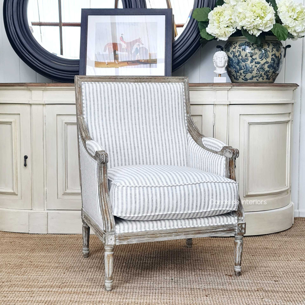 The Pearson armchair as a stunning accent in a modern provincial living space, its neutral hues complementing various palettes.