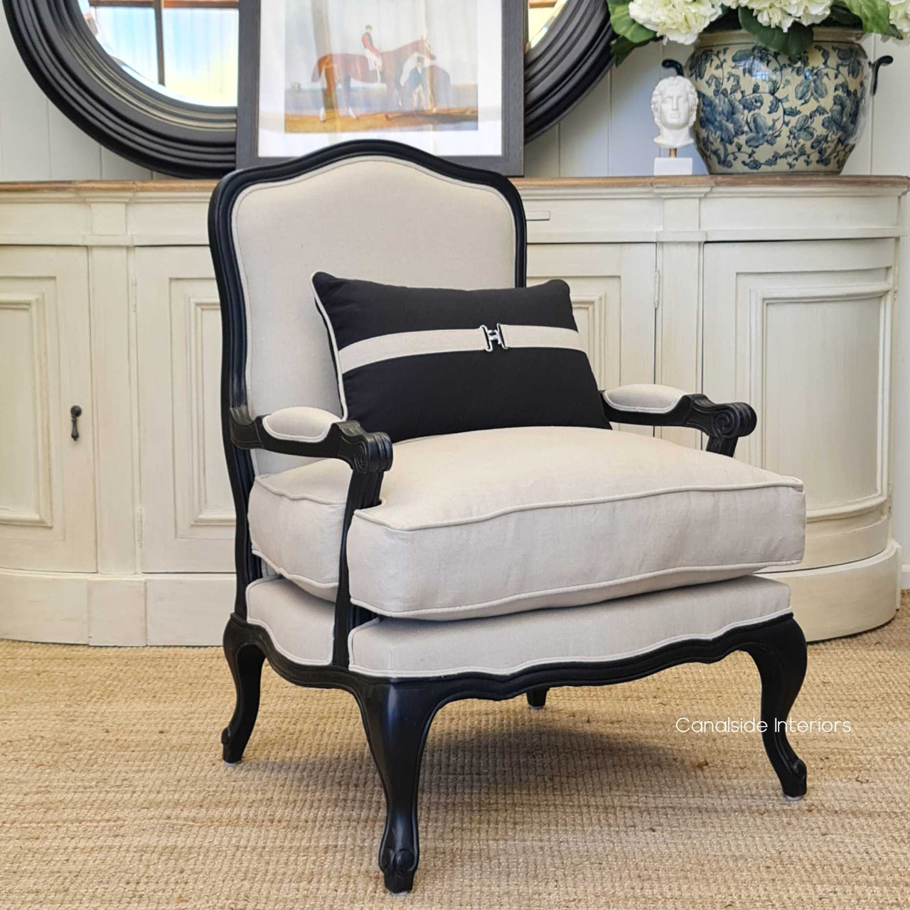 Lifestyle image in a coastal-inspired lounge room, showing how the armchair complements light, airy interiors.