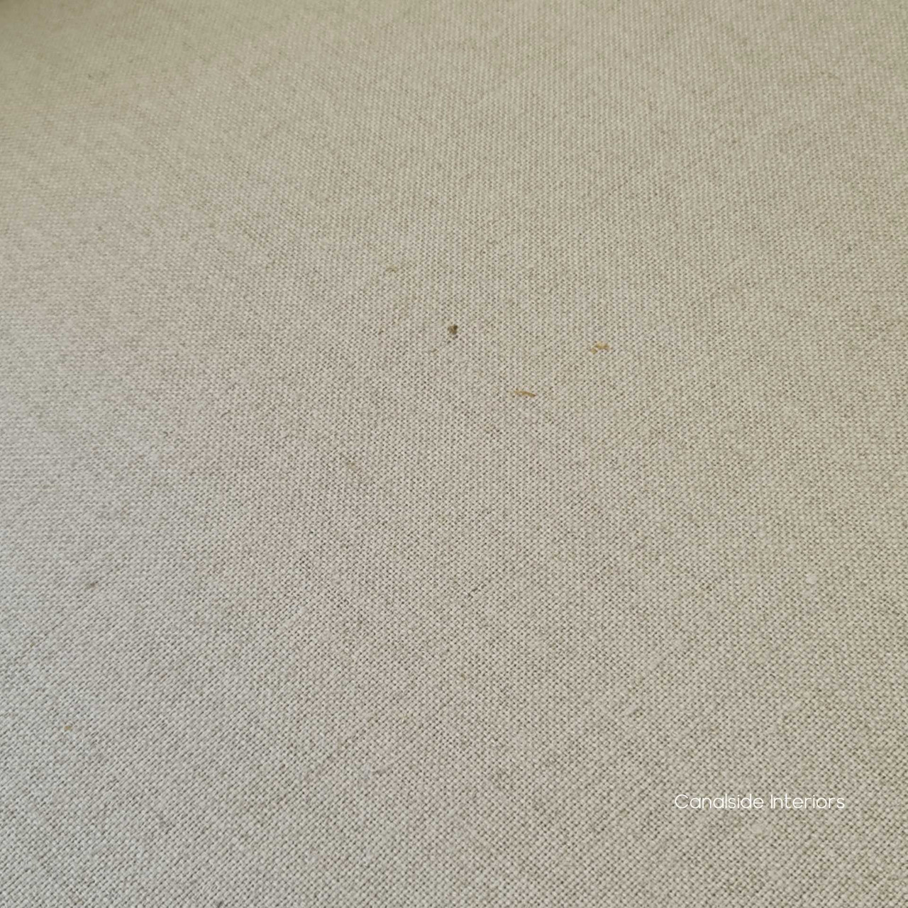 Close-up of the chair's linen blend upholstery, reflecting the quality materials and comfortable texture.