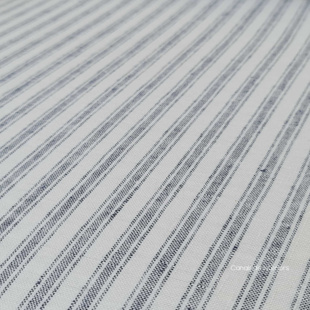 Close-up on the armchair's brass/gold studded detailing, showcasing the meticulous craftsmanship and attention to detail.