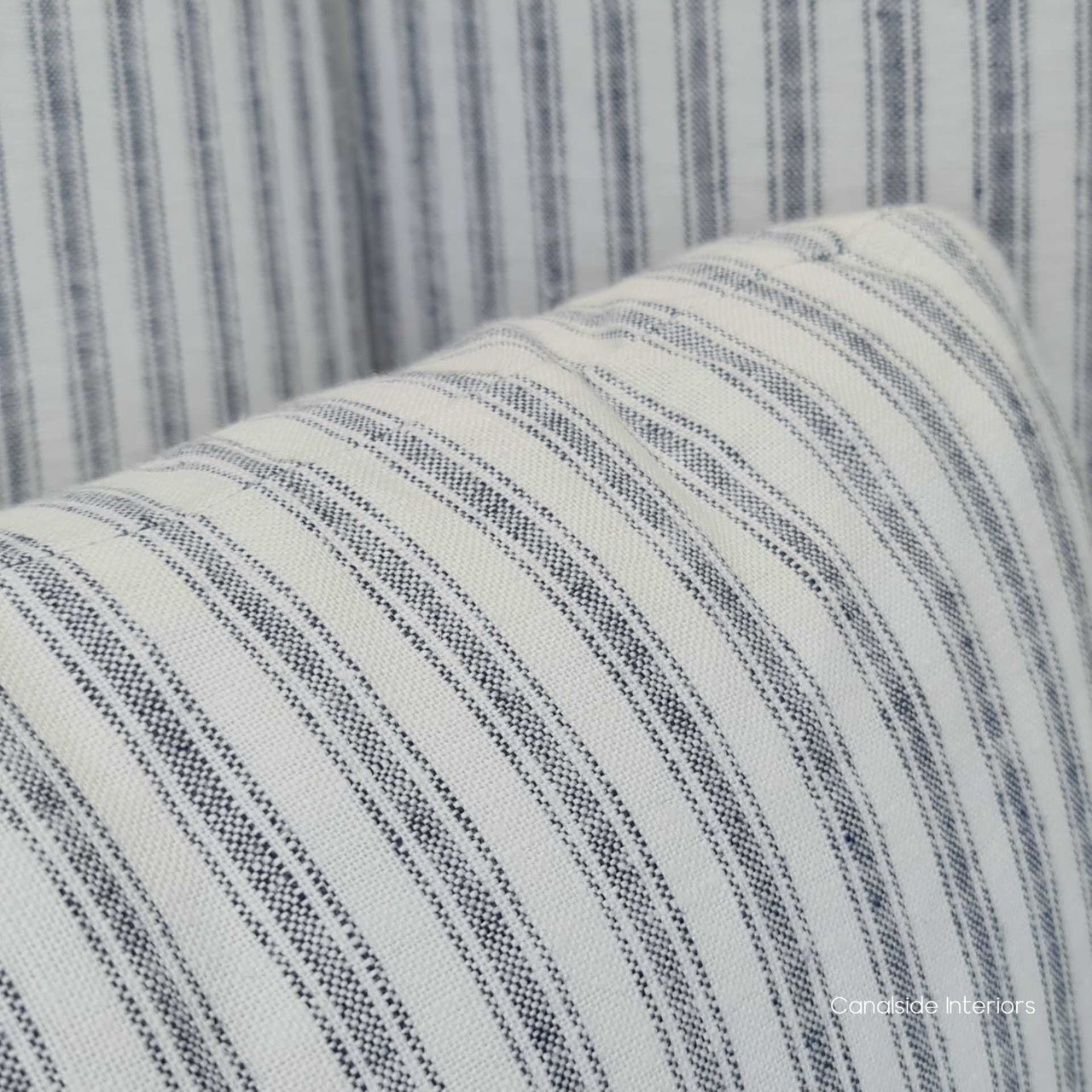 Close-up on the armchair's brass/gold studded detailing, showcasing the meticulous craftsmanship and attention to detail.