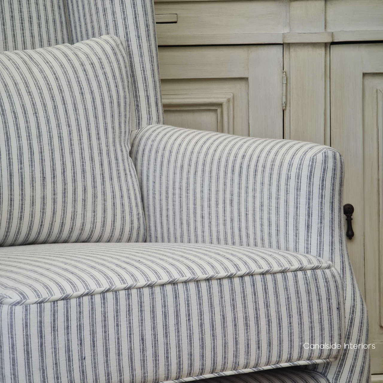 The Bayview armchair angled in a way that demonstrates its versatility as both a functional seating option and a decorative accent.