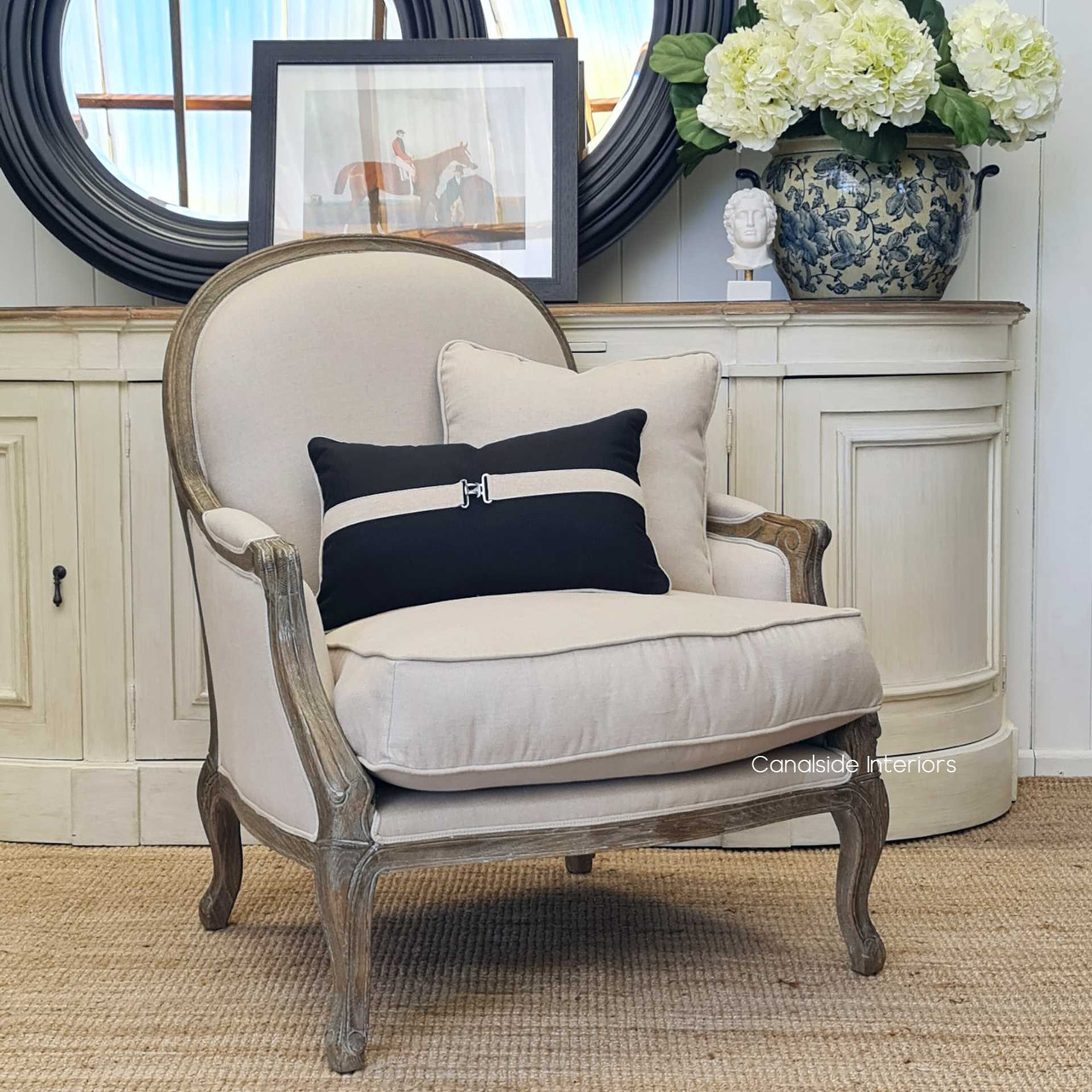 Lifestyle image of the Monette Occasional Armchair in a living room setting, surrounded by other Canalside Interiors pieces, highlighting its ability to complement and elevate the room's overall design.