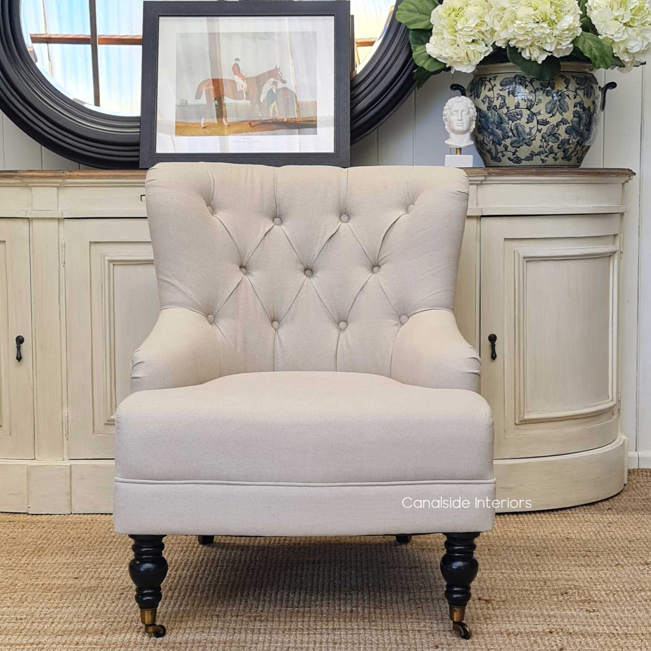 Frontal view of the Ascott Armchair, with its tufted back and comfortable seating, ready to enhance any living space with Canalside Interiors' signature style.
