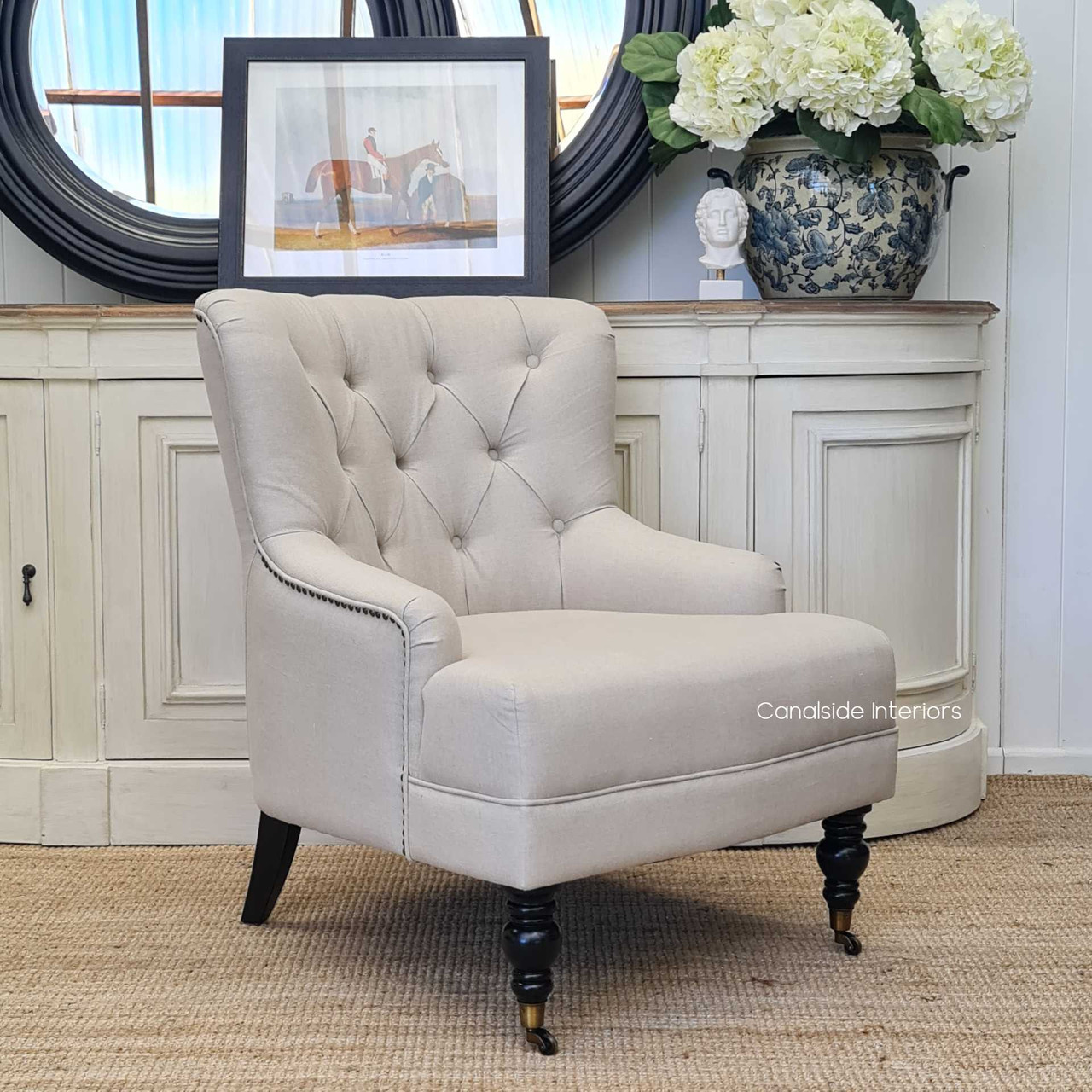 The Ascott Armchair featured in a luxurious coastal retreat, perfectly matching the serene and sophisticated decor.