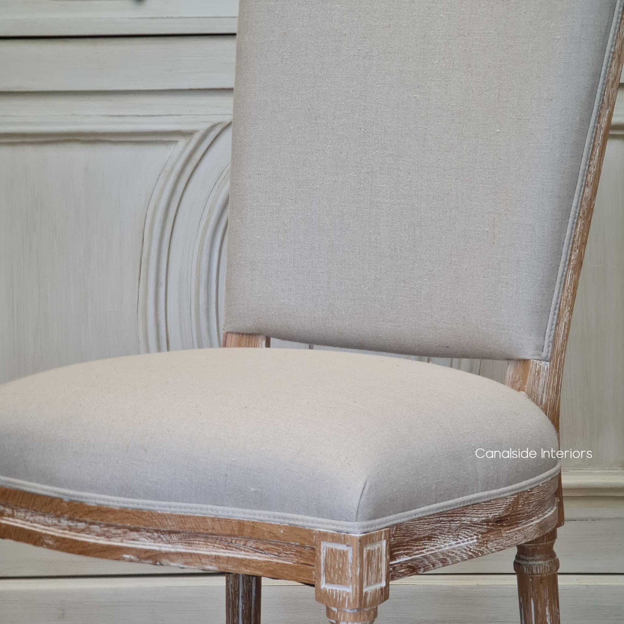 Enhance your dining setting with the Knightley Chair from Canalside Interiors, where coastal elegance meets handcrafted quality in a limewash oak frame.