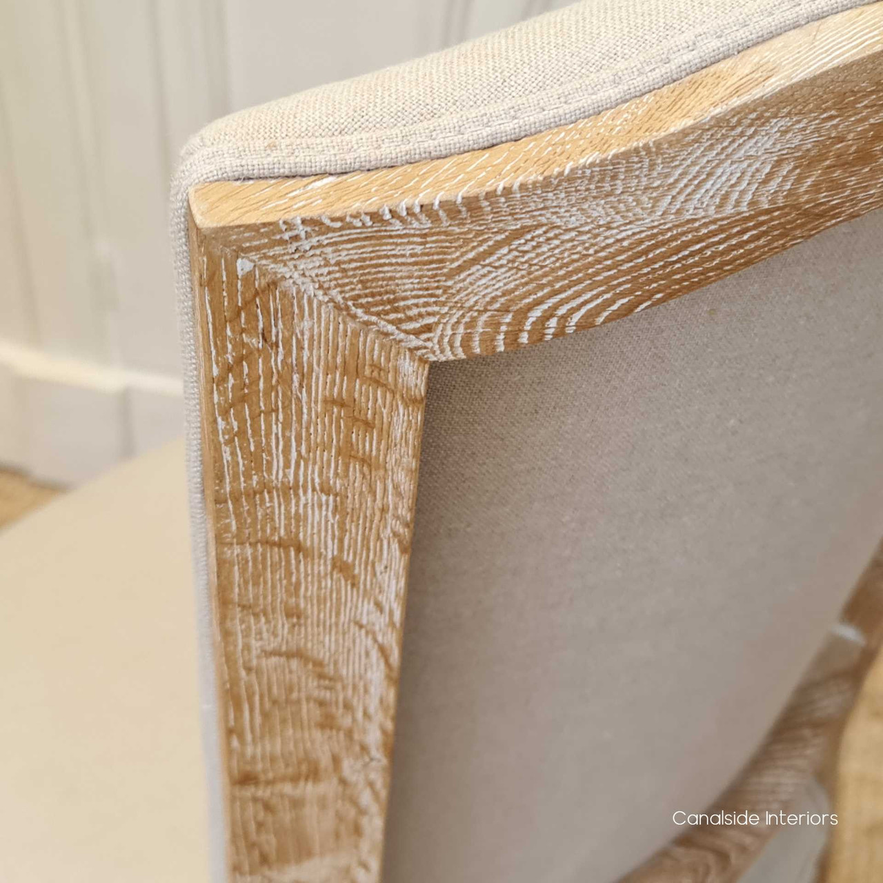 Canalside Interiors offers the Knightley Dining Chair, a masterpiece of design with a hand-carved frame that complements any sophisticated dining area