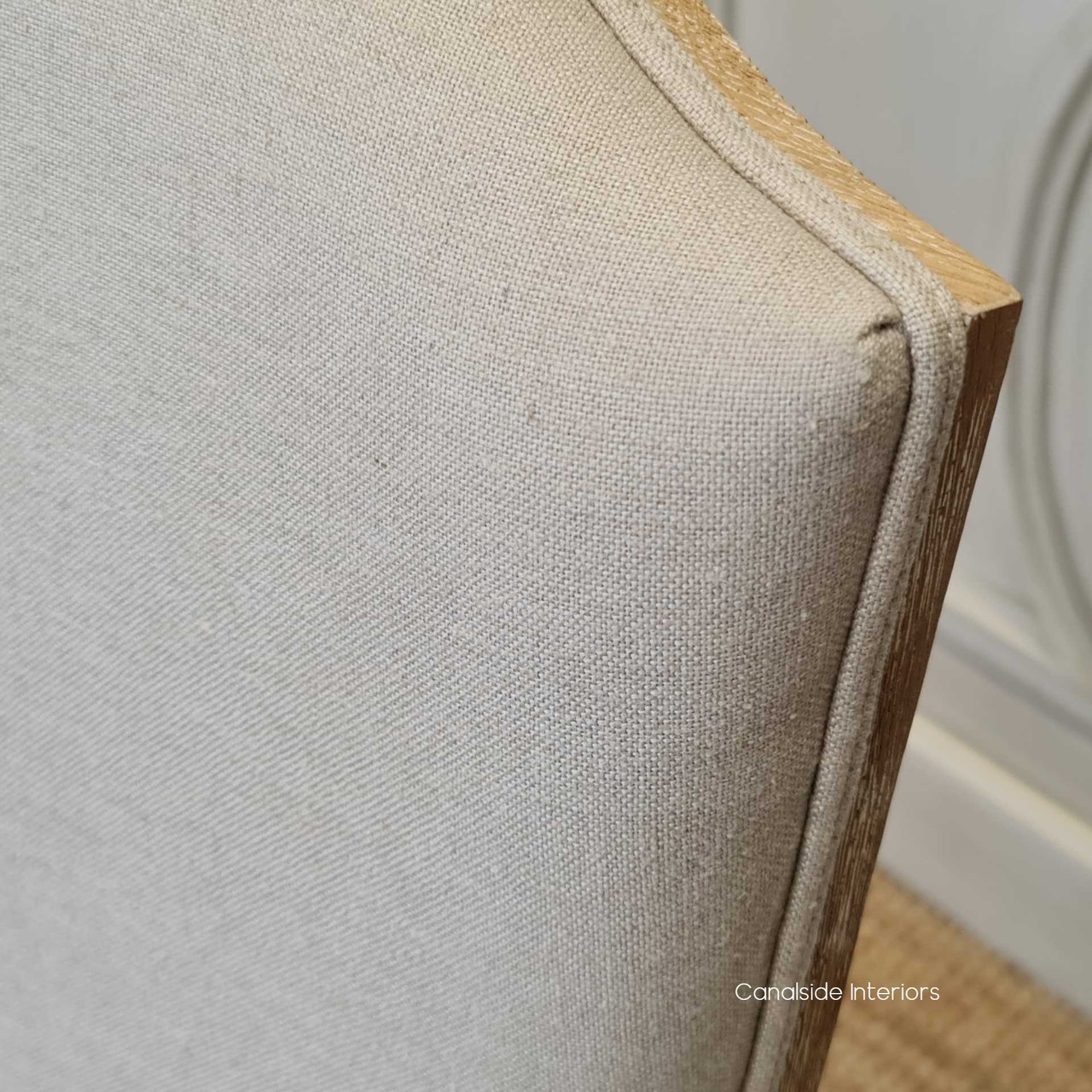 A harmonious addition to your dining room, Canalside Interiors' Knightley Chair in cream linen showcases the seamless beauty of classical craftsmanship
