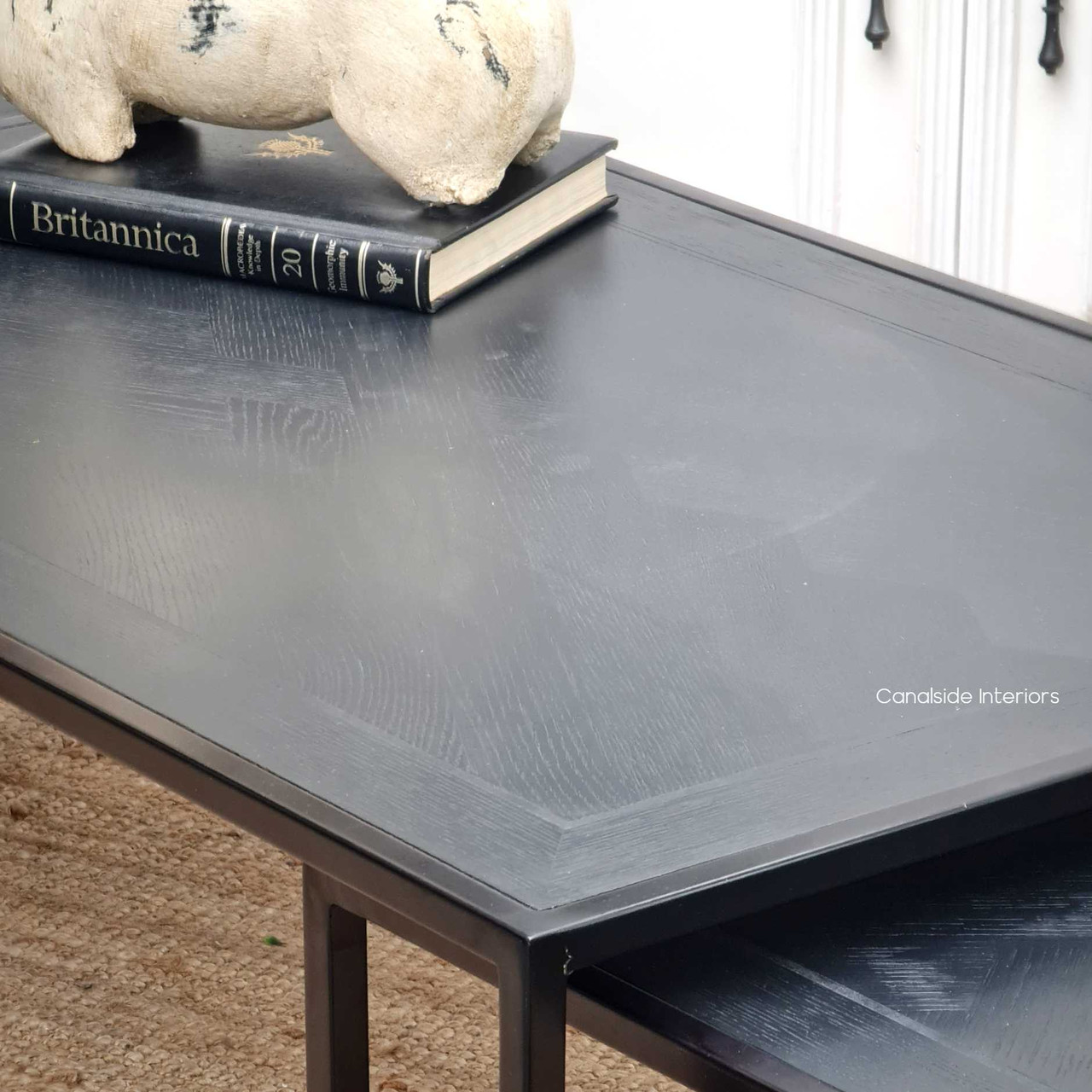 Close-up of the herringbone pattern on the distressed charcoal top, highlighting the intricate details and quality craftsmanship.