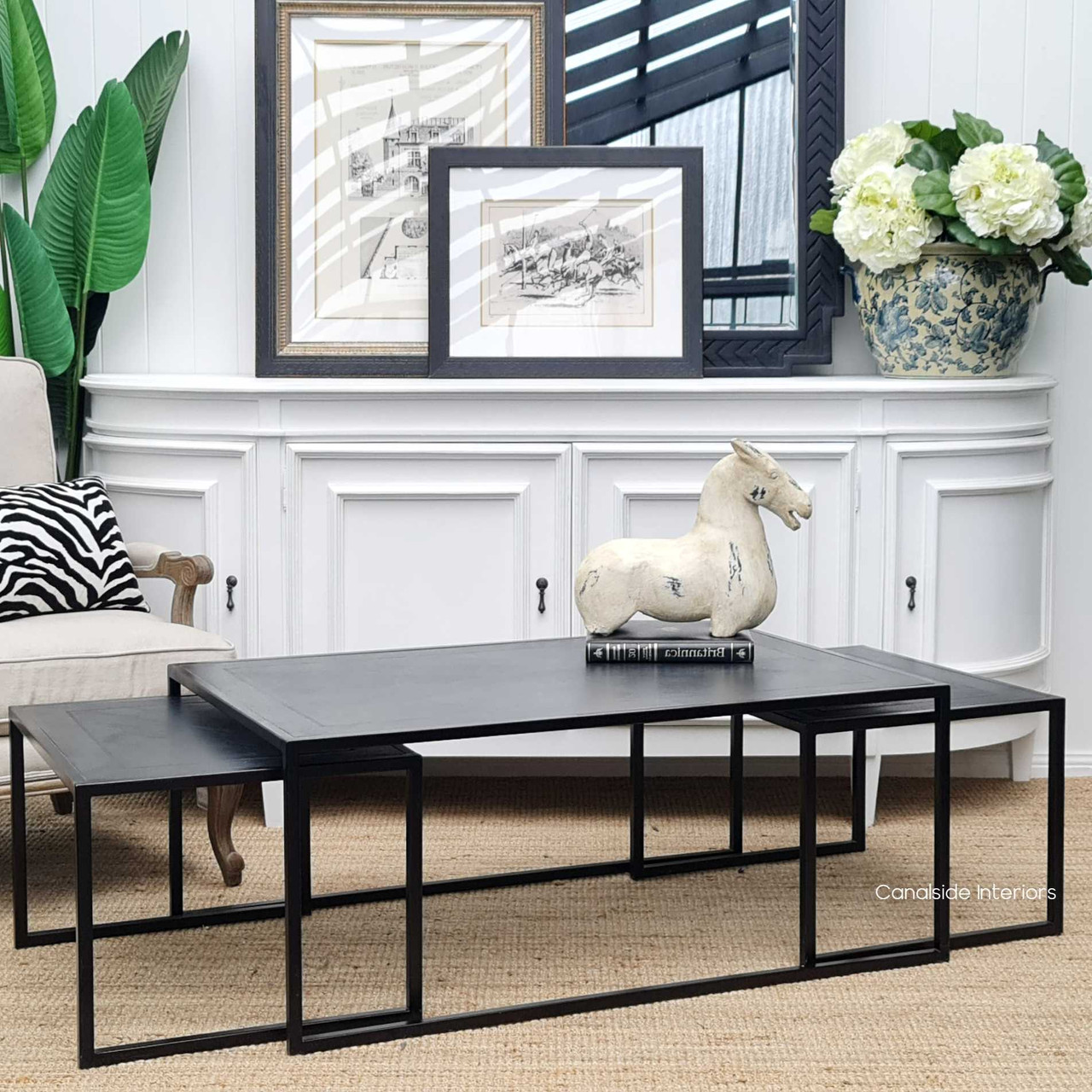 Angled shot of the coffee table set, emphasizing the elegant metal frame and the harmonious blend with the distressed charcoal top.