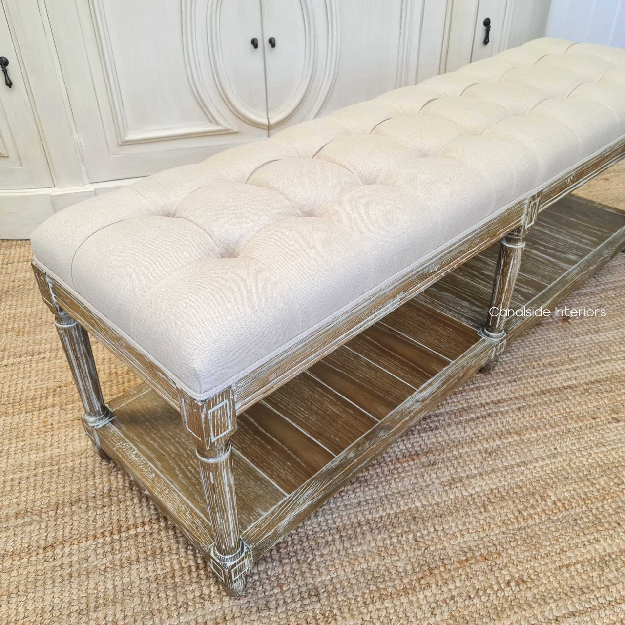 Integrated into a coastal-themed decor, where its weathered oak and cream upholstery perfectly match the relaxed yet chic vibe.